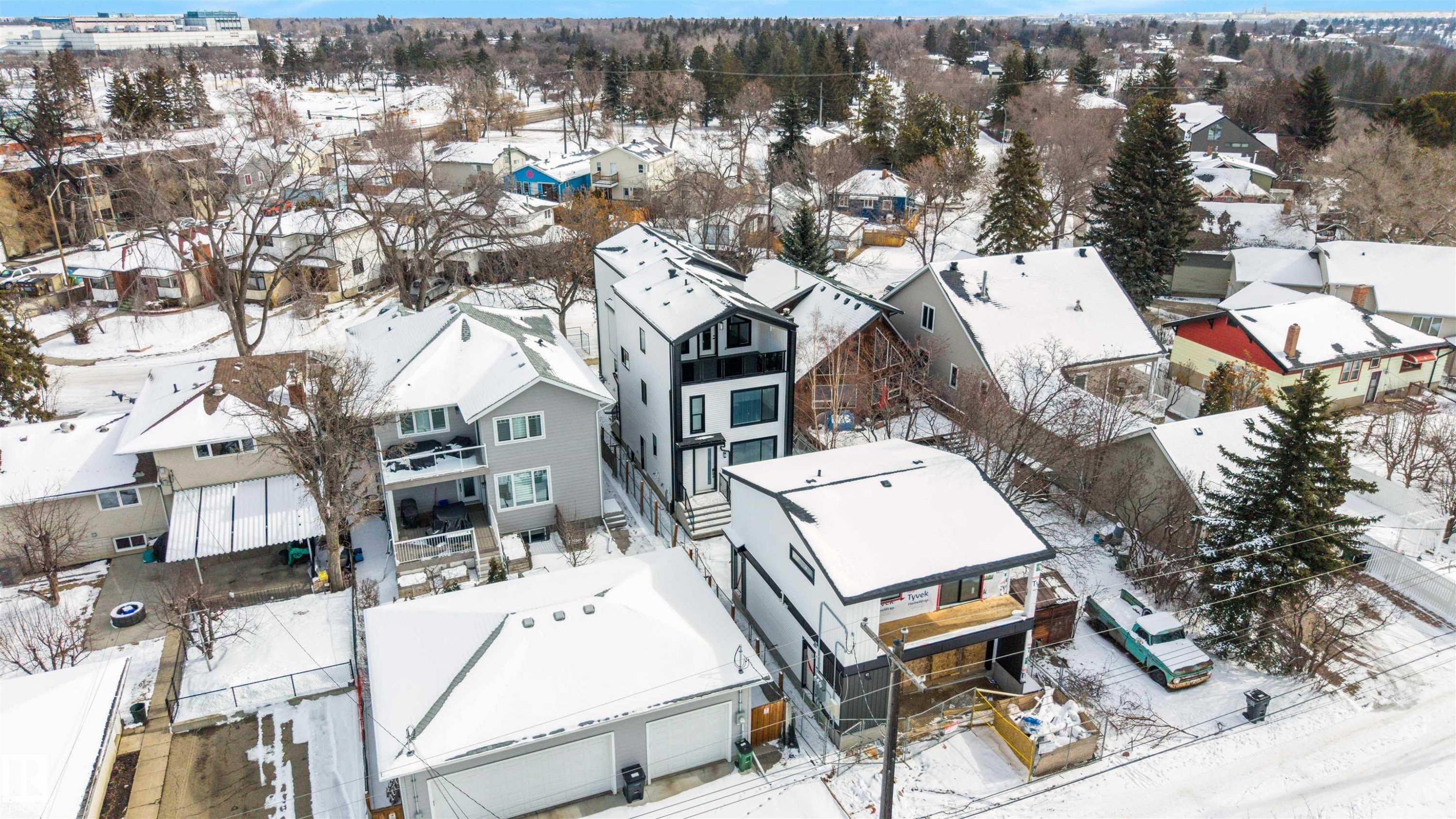 This property features a contemporary architectural style with a distinctive black and white exterior - 7927 112S Avenue, Edmonton, AB - Outdoor