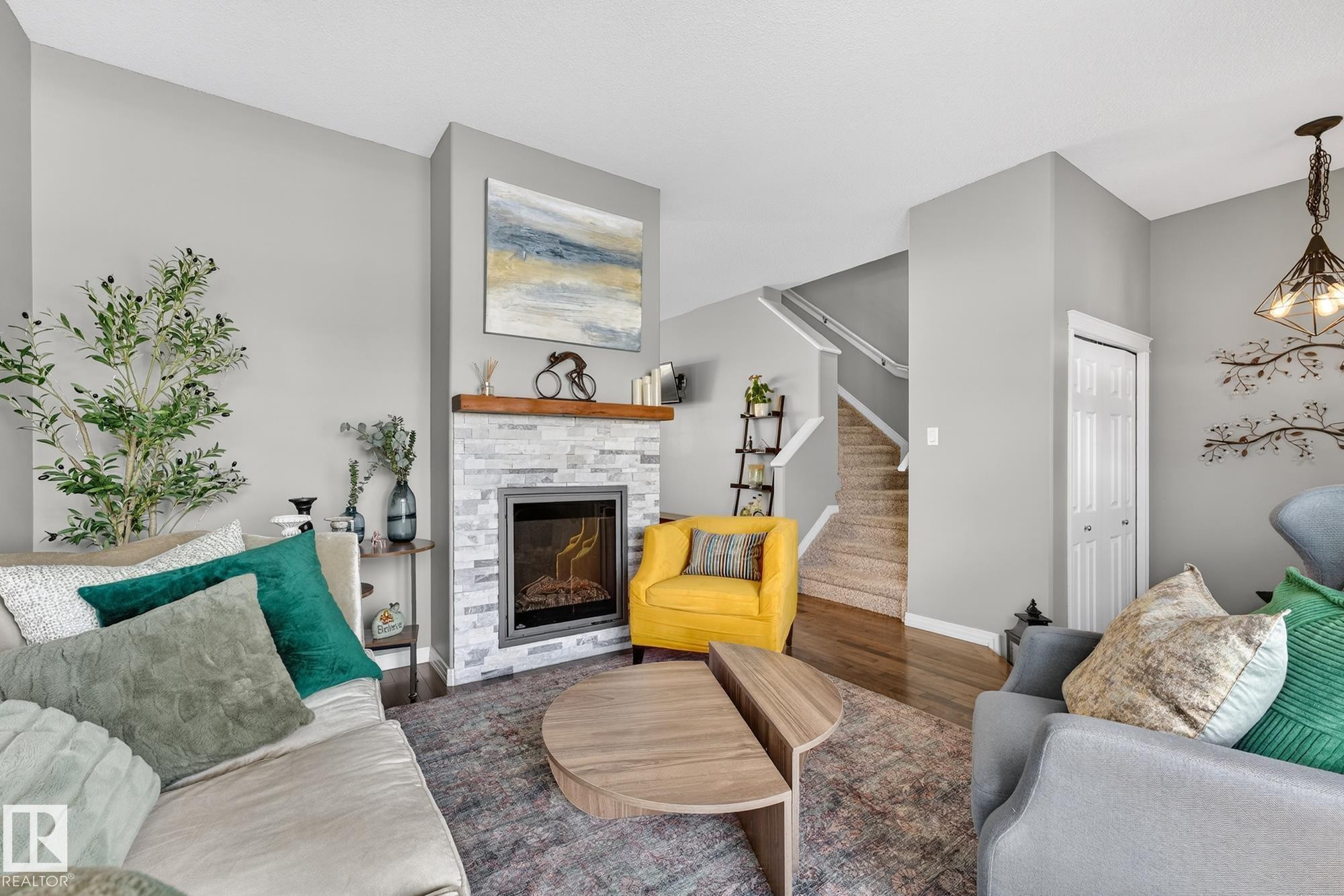 11 4367 Veterans Way, Edmonton, AB - Indoor Photo Showing Living Room With Fireplace