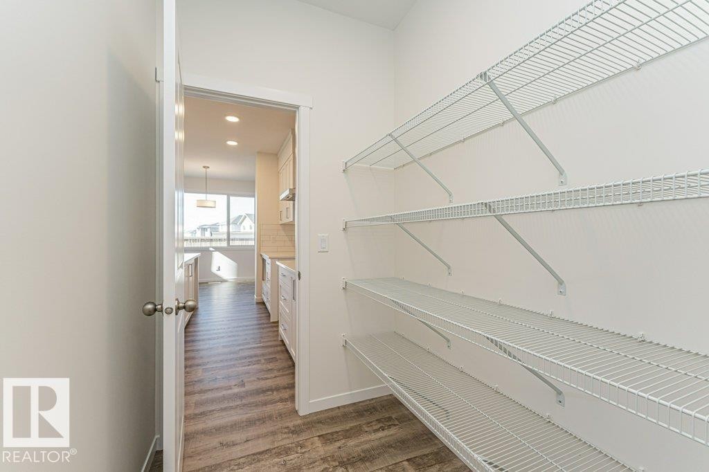 Walk-in pantry featuring multiple levels of wire shelving - 6271 180 Avenue Nw, Edmonton, AB