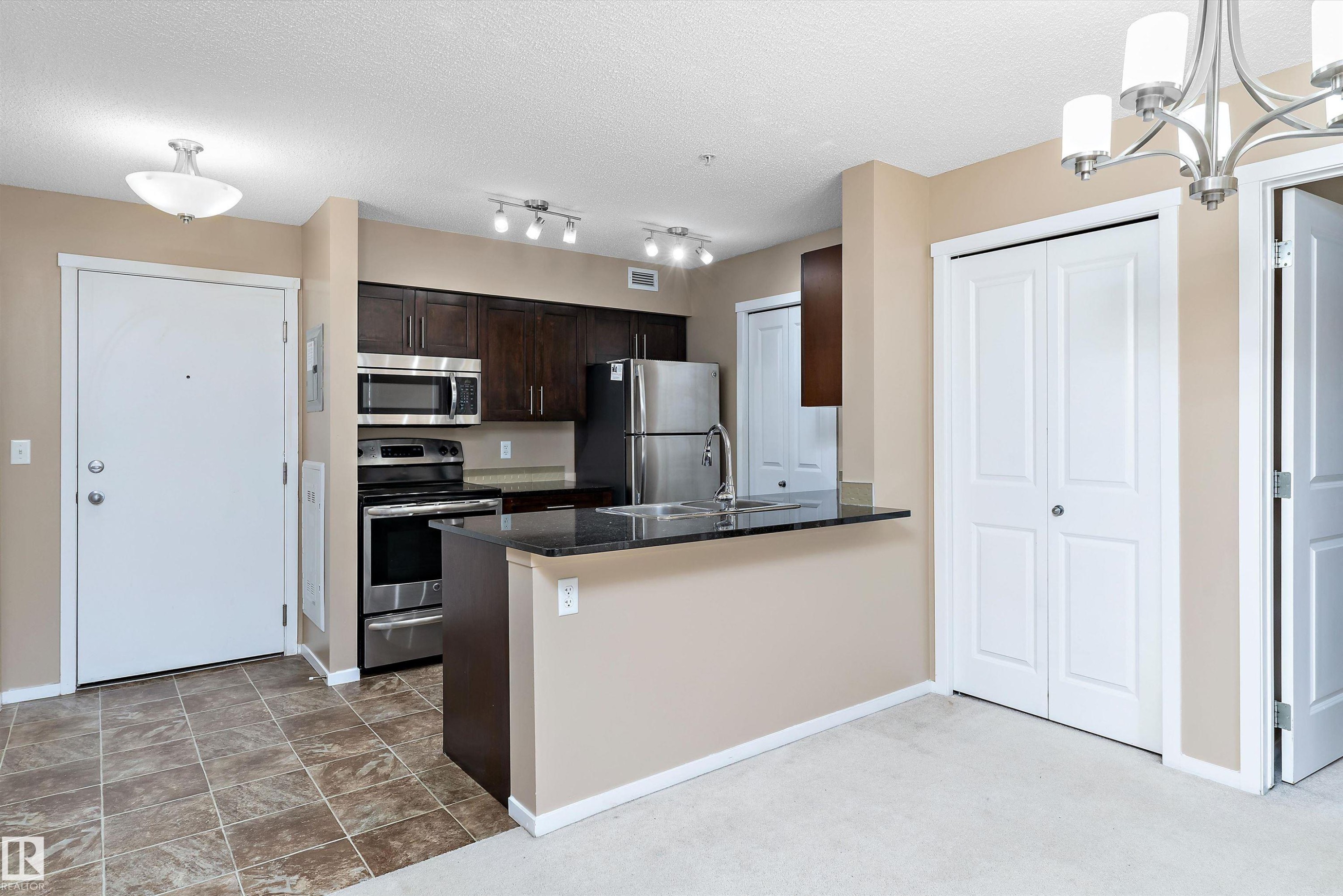 105 111 Watt Common, Edmonton, AB - Indoor Photo Showing Kitchen With Stainless Steel Kitchen