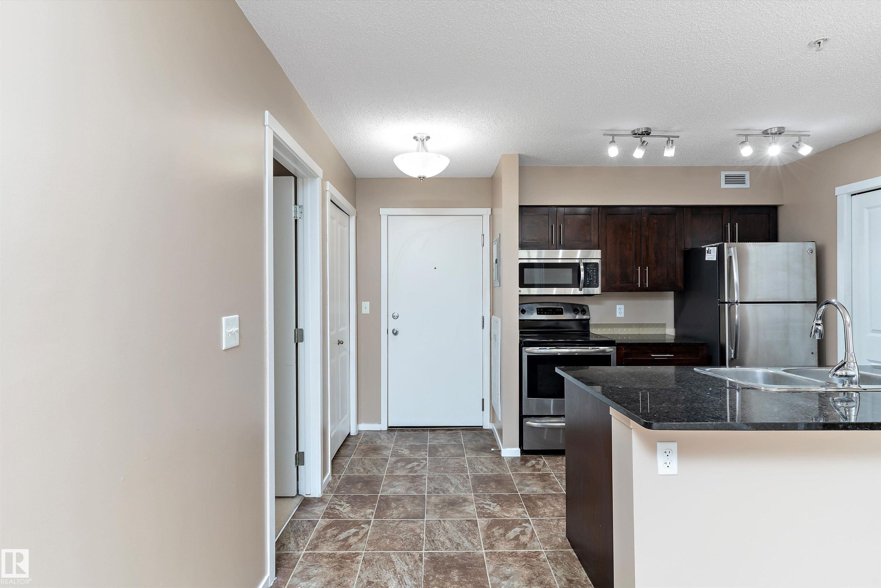 105 111 Watt Common, Edmonton, AB - Indoor Photo Showing Kitchen With Stainless Steel Kitchen