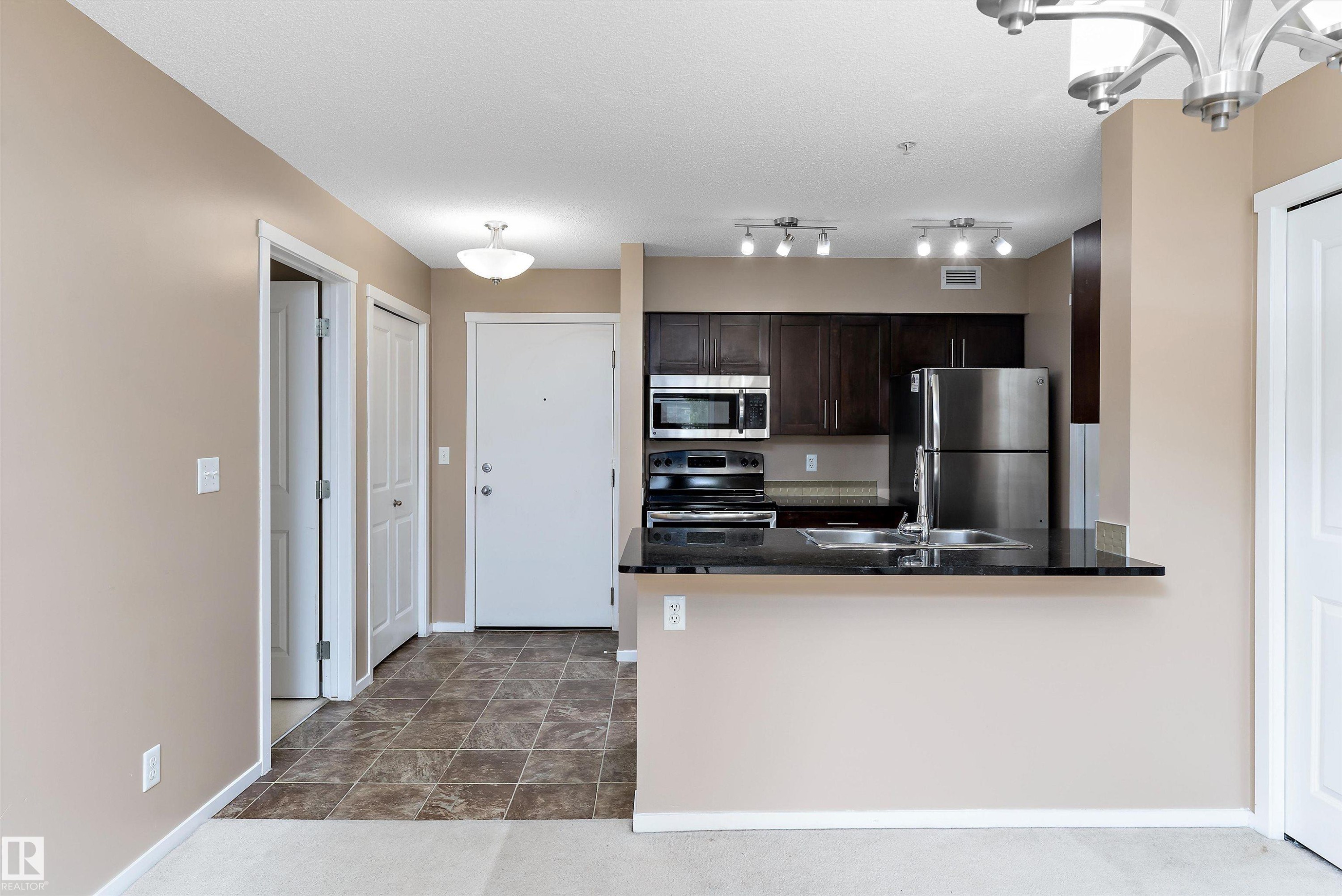 105 111 Watt Common, Edmonton, AB - Indoor Photo Showing Kitchen With Double Sink