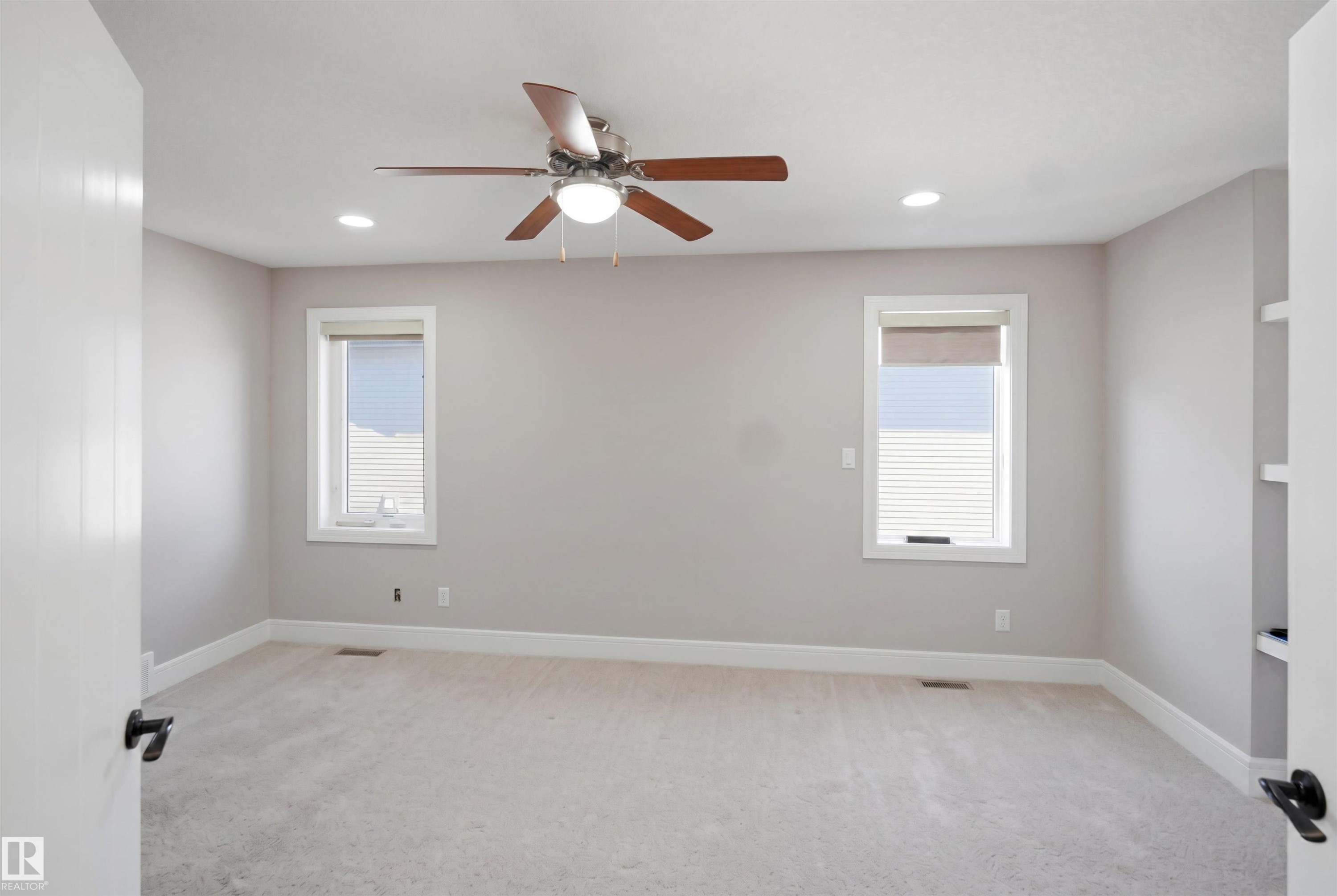 Spacious room featuring neutral carpeting and light gray walls - 2256 Cameron Ravine Court, Edmonton, AB - Indoor Photo Showing Other Room