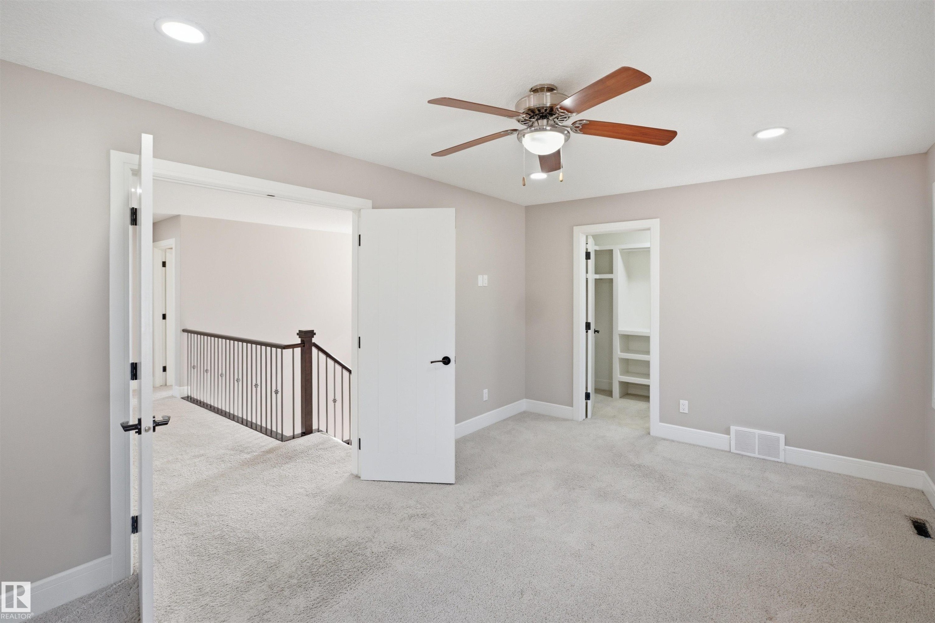 Spacious room featuring light gray carpeting and recessed lighting - 2256 Cameron Ravine Court, Edmonton, AB - Indoor Photo Showing Other Room