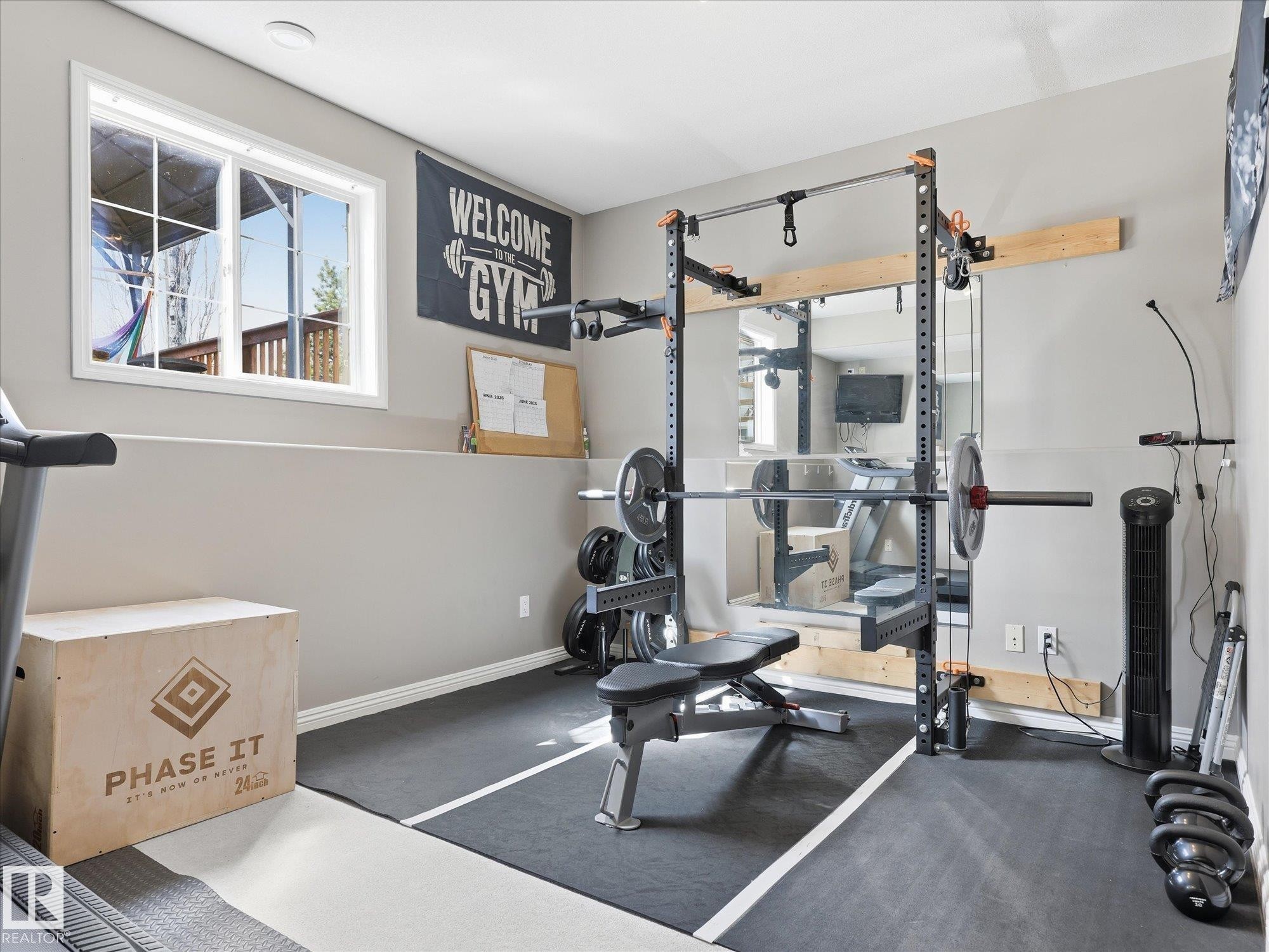 Versatile room with neutral-toned walls, recessed lighting, and a white-framed window - 1340 Oakland Crescent, Devon, AB - Indoor Photo Showing Gym Room