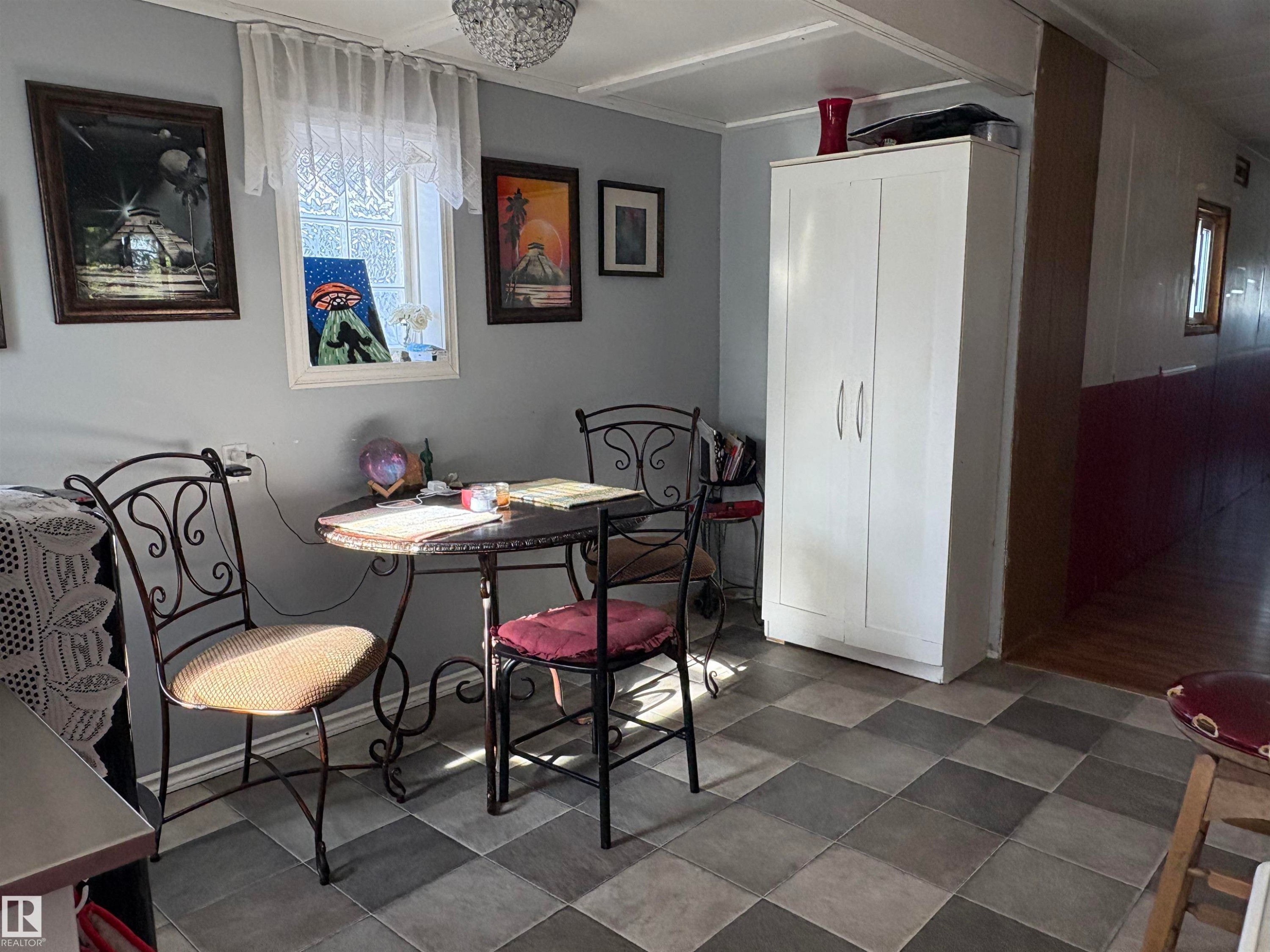 Checkered floor tile providing visual interest. - 115 2Nd Street E, Derwent, AB - Indoor