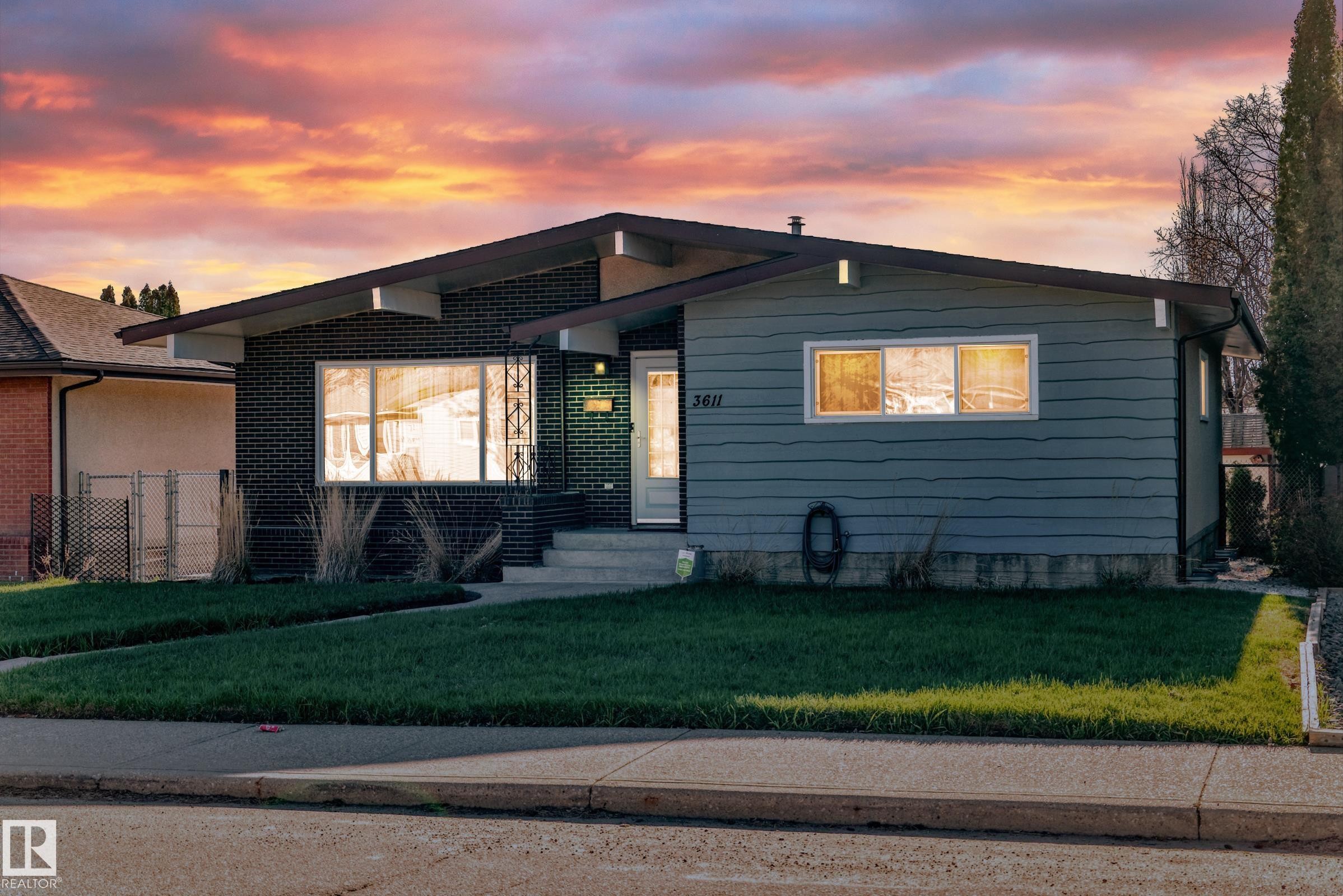 Mid-century modern residence featuring a low-slope roofline and a combination of dark brick and horizontal siding - 3611 108 Street, Edmonton, AB - Outdoor