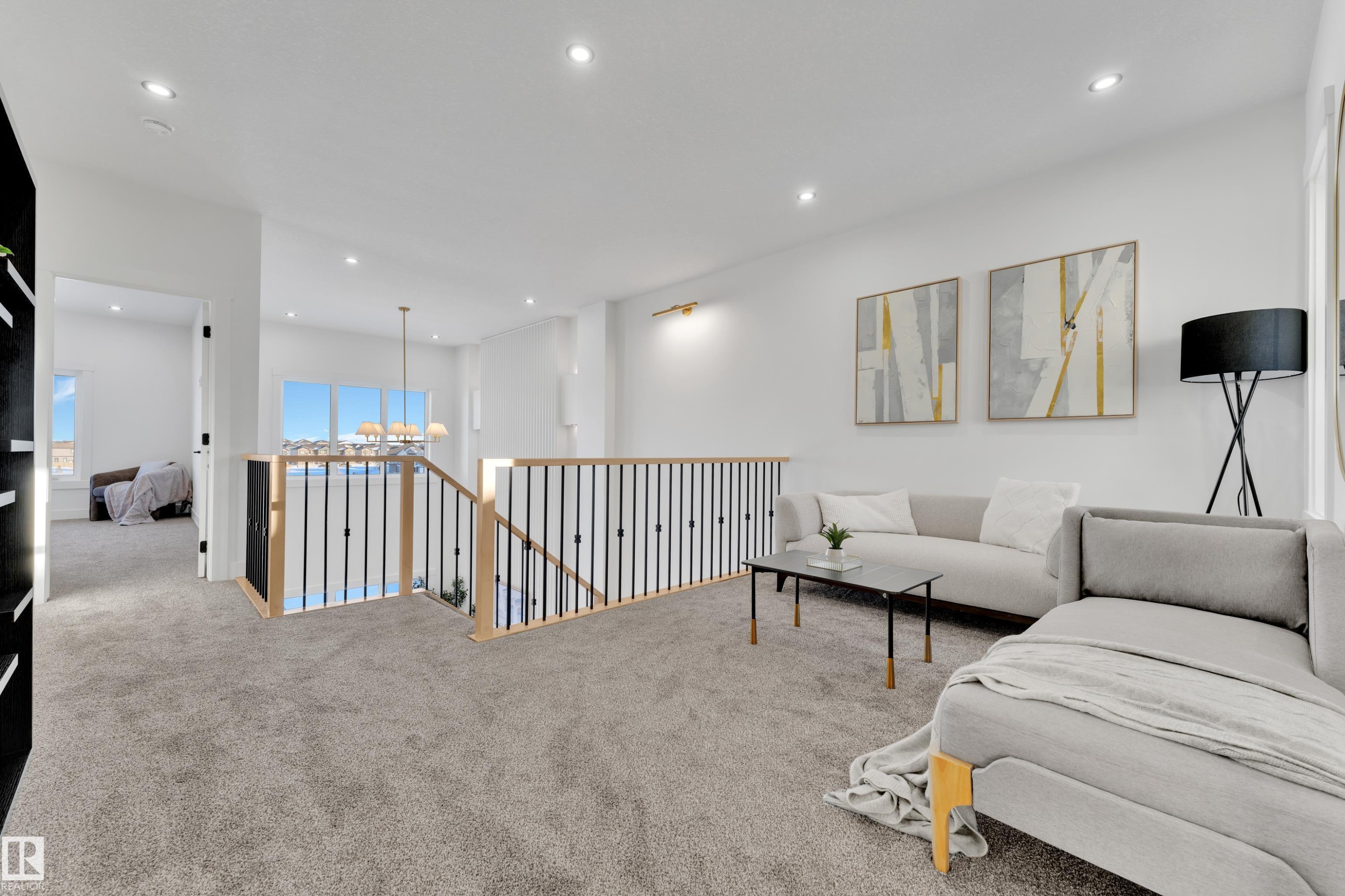 Upper-level landing featuring plush gray carpeting, white walls, and recessed lighting - 382 Linden Loop, Leduc, AB - Indoor
