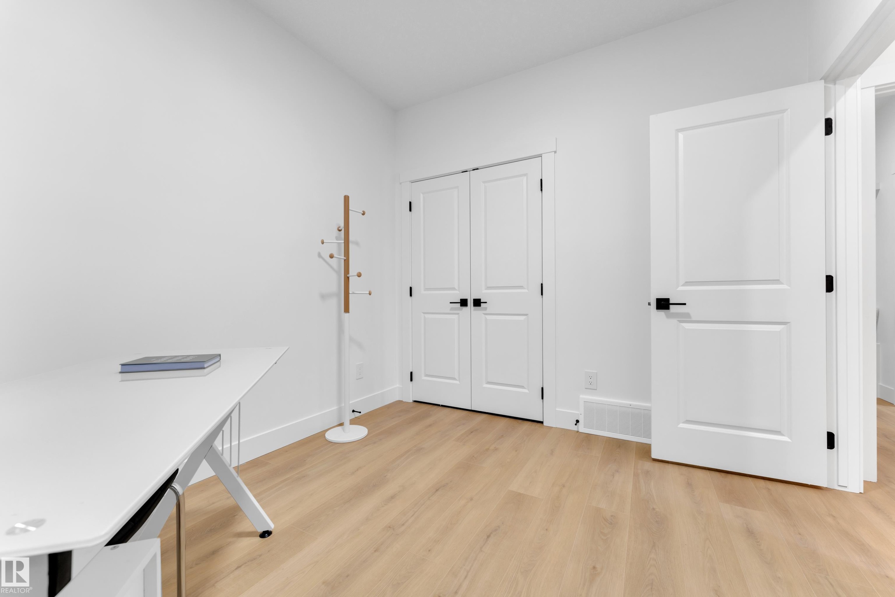 Bright interior space featuring light wood-finish flooring - 382 Linden Loop, Leduc, AB - Indoor Photo Showing Other Room