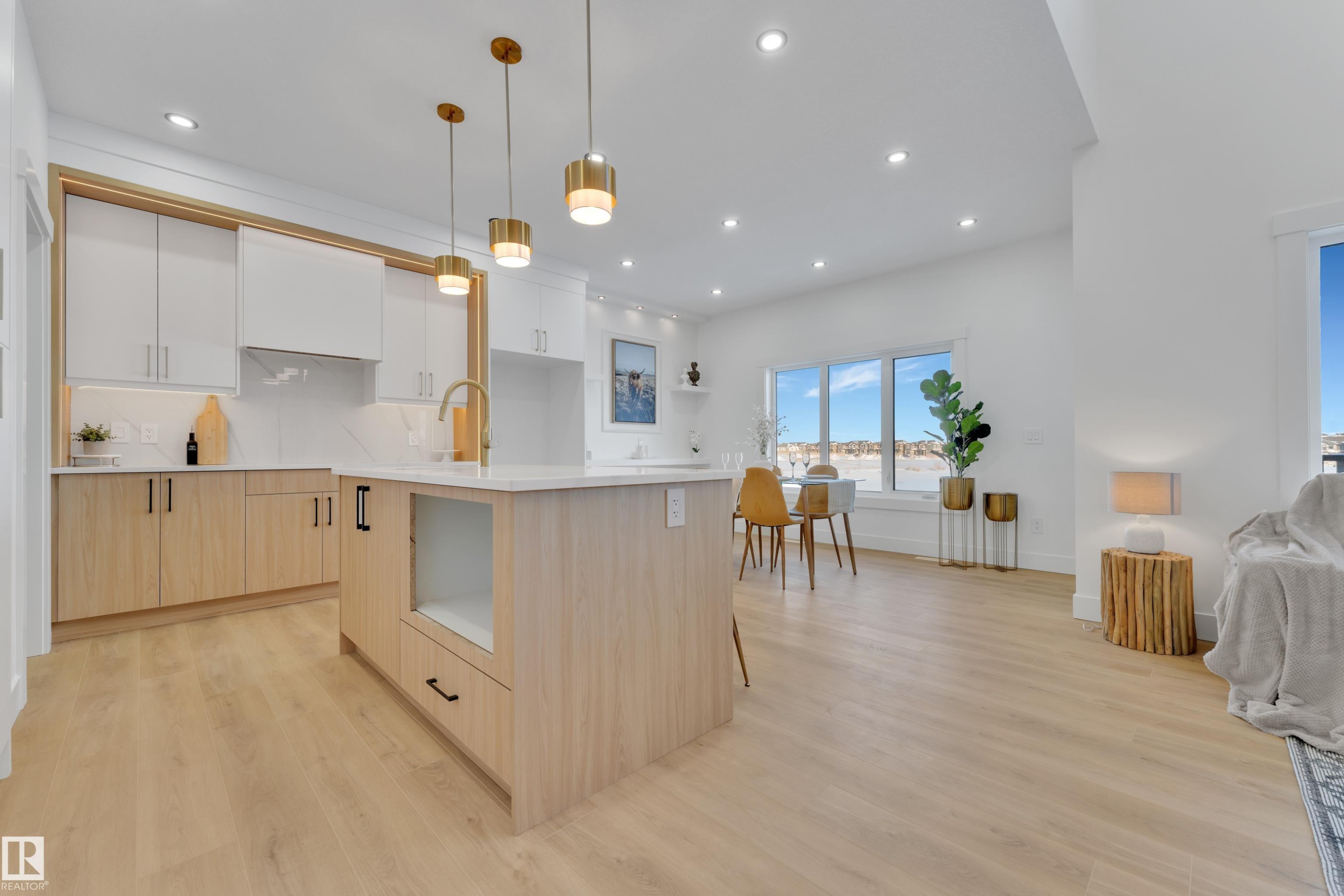 Open-concept kitchen and dining area featuring light wood-finish flooring - 382 Linden Loop, Leduc, AB - Indoor Photo Showing Kitchen With Upgraded Kitchen