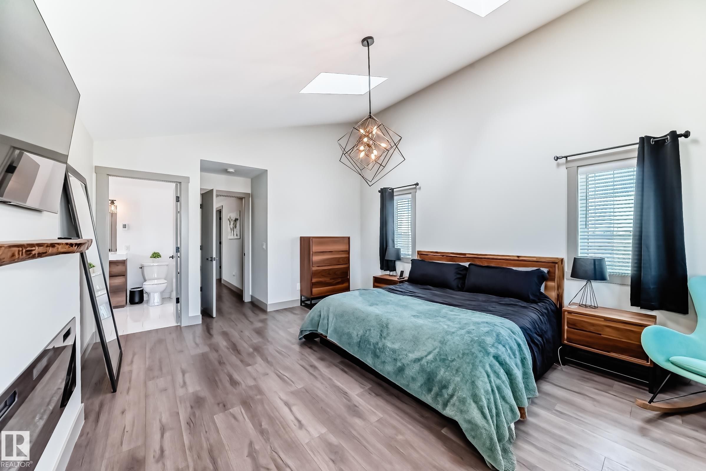 Spacious room featuring vaulted ceilings, wood-finish flooring, and recessed lighting - 5263 47 Ave, Calmar, AB - Indoor Photo Showing Bedroom