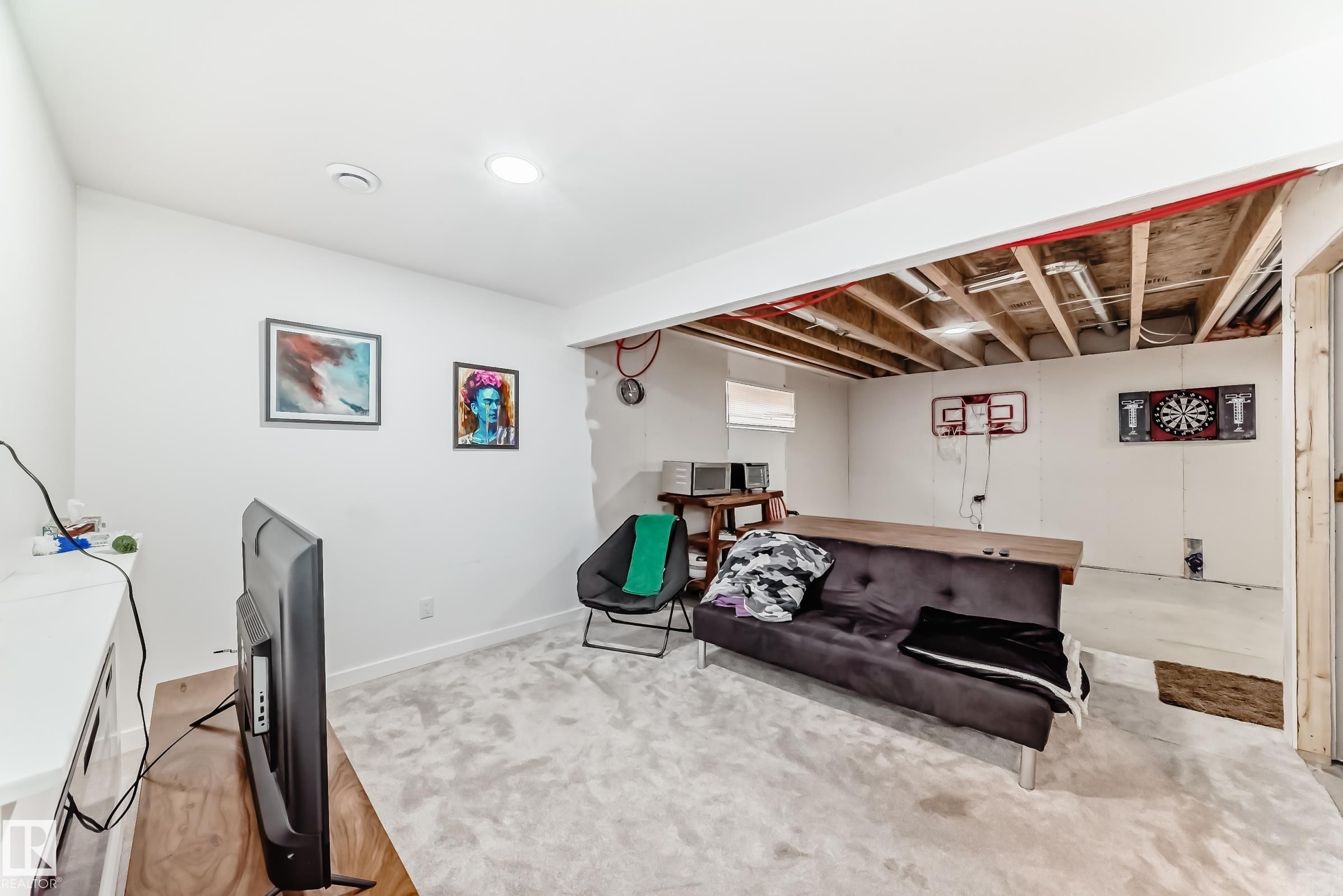Finished basement area with recessed lighting, white walls, and light-toned carpeting - 5263 47 Ave, Calmar, AB - Indoor