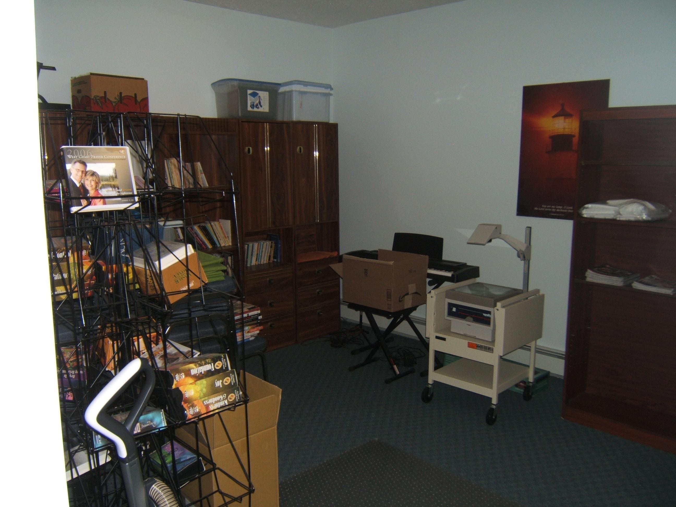 Light blue wall color and patterned blue carpeting define this interior space - 4707 50 Street, Two Hills, AB - Indoor