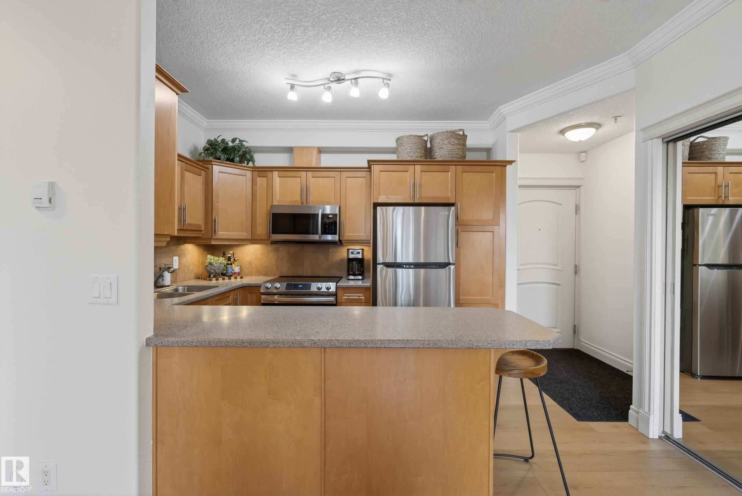 #303 8631 108 St Nw, Edmonton, AB - Indoor Photo Showing Kitchen With Stainless Steel Kitchen