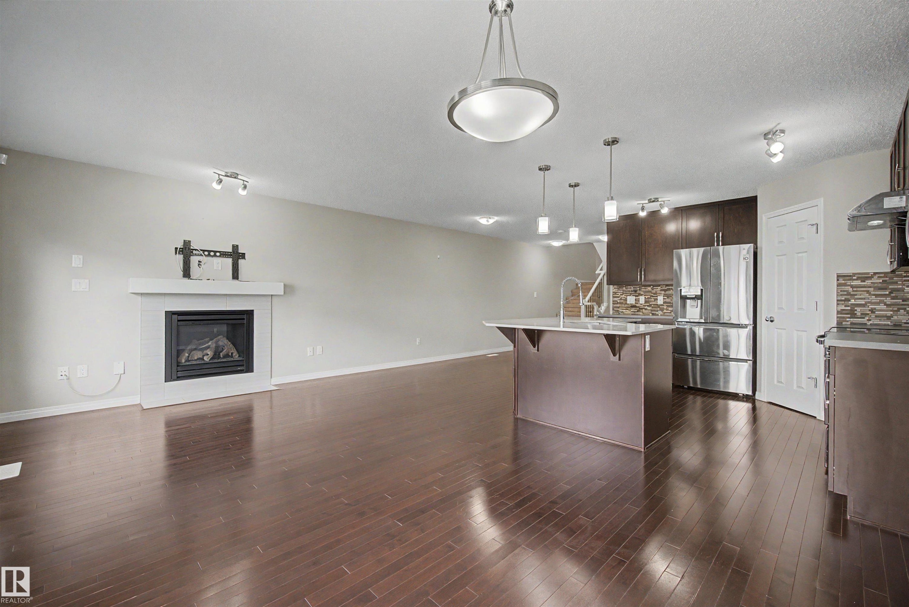 2534 Coughlan Road, Edmonton, AB - Indoor Photo Showing Kitchen With Fireplace With Upgraded Kitchen