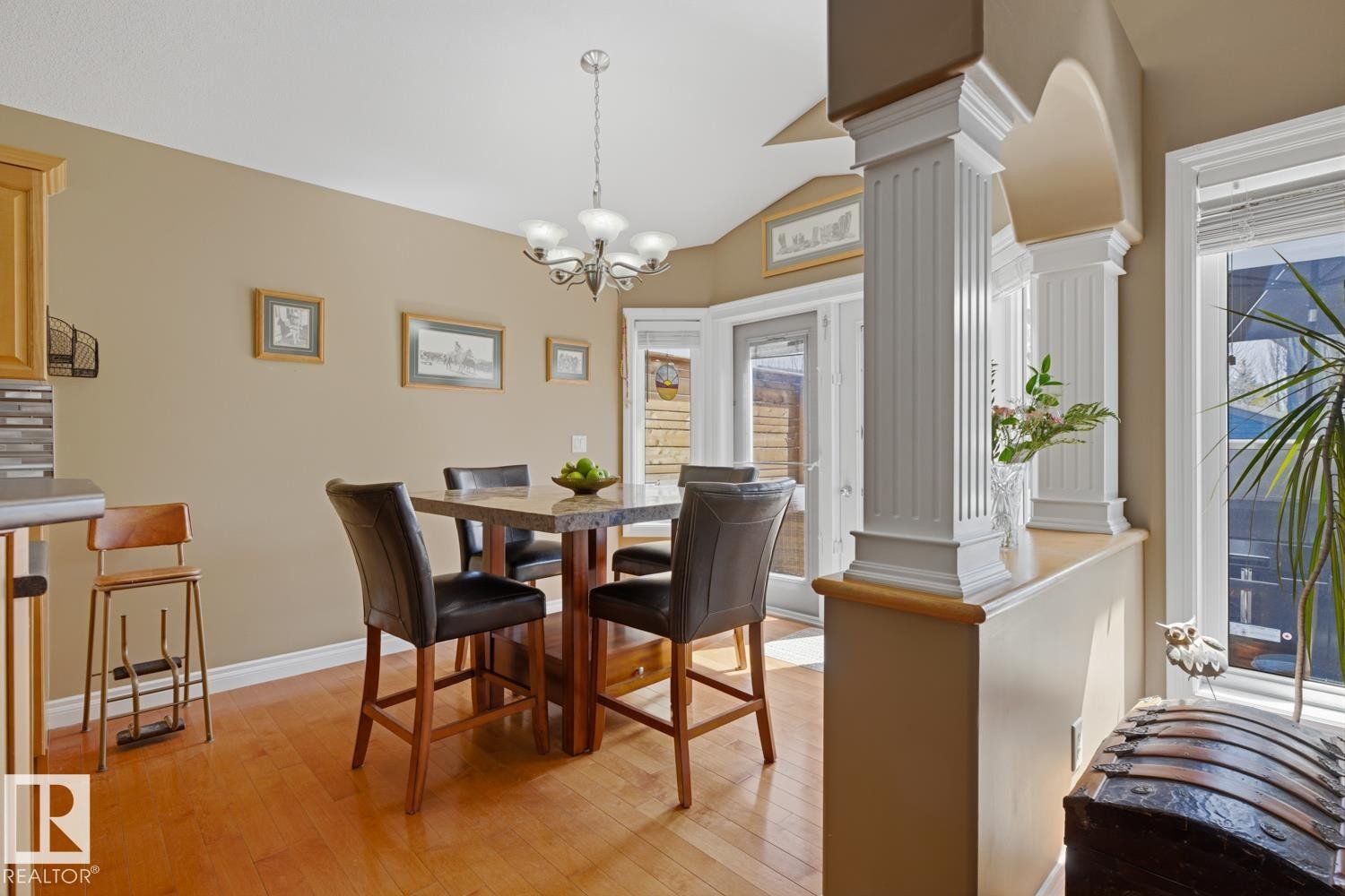 Dining area featuring wood-finish flooring and a contemporary chandelier - 9 Danfield Place, Spruce Grove, AB - Indoor Photo Showing Dining Room