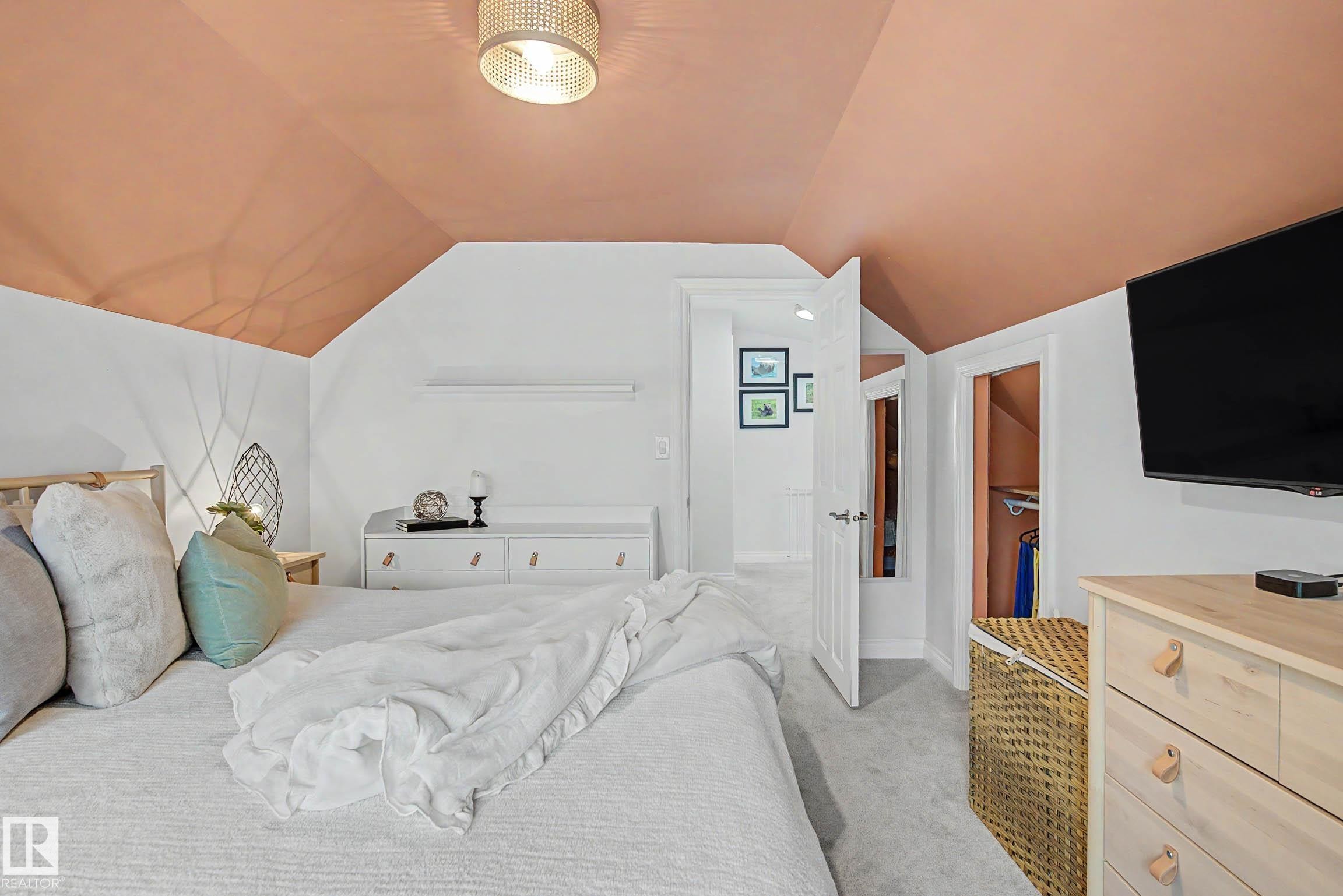 Attic room featuring a sloped ceiling, recessed lighting, and light-toned carpeting - 13316 109A Avenue, Edmonton, AB - Indoor Photo Showing Bedroom