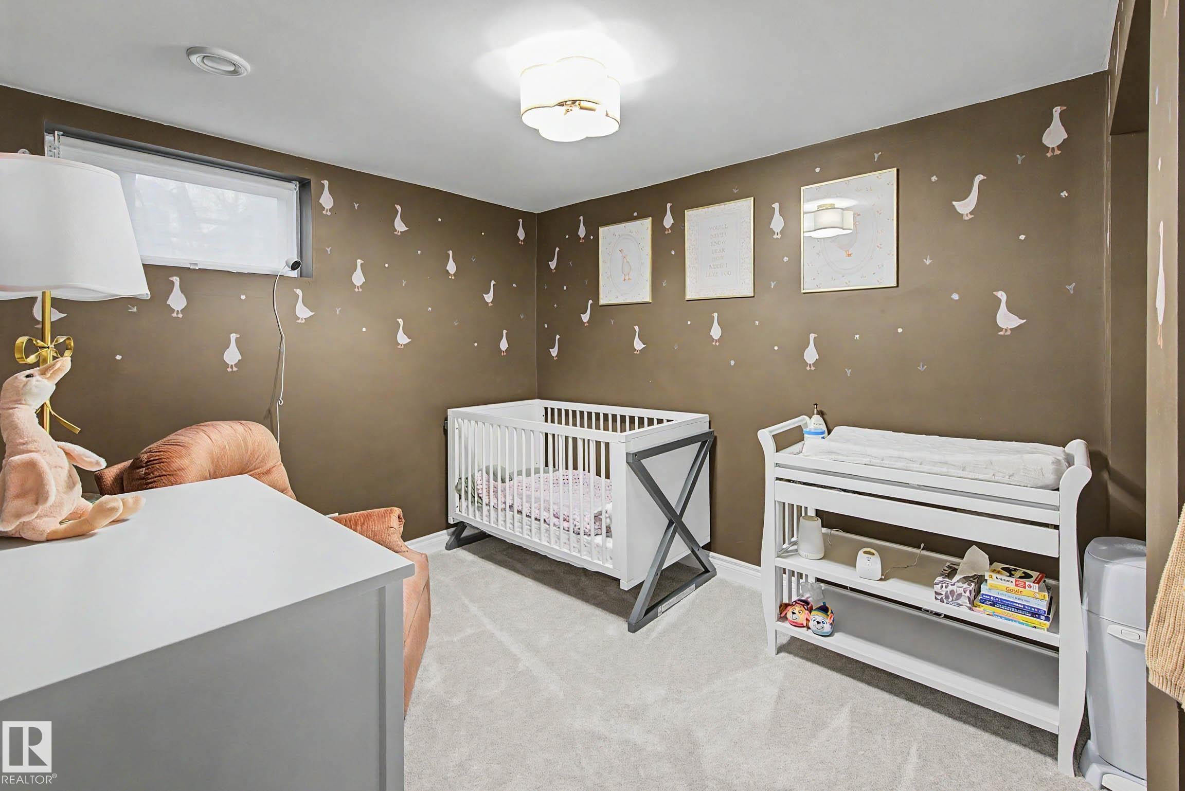 Carpeted room featuring a white ceiling, recessed lighting, and a flush-mount light fixture - 13316 109A Avenue, Edmonton, AB - Indoor