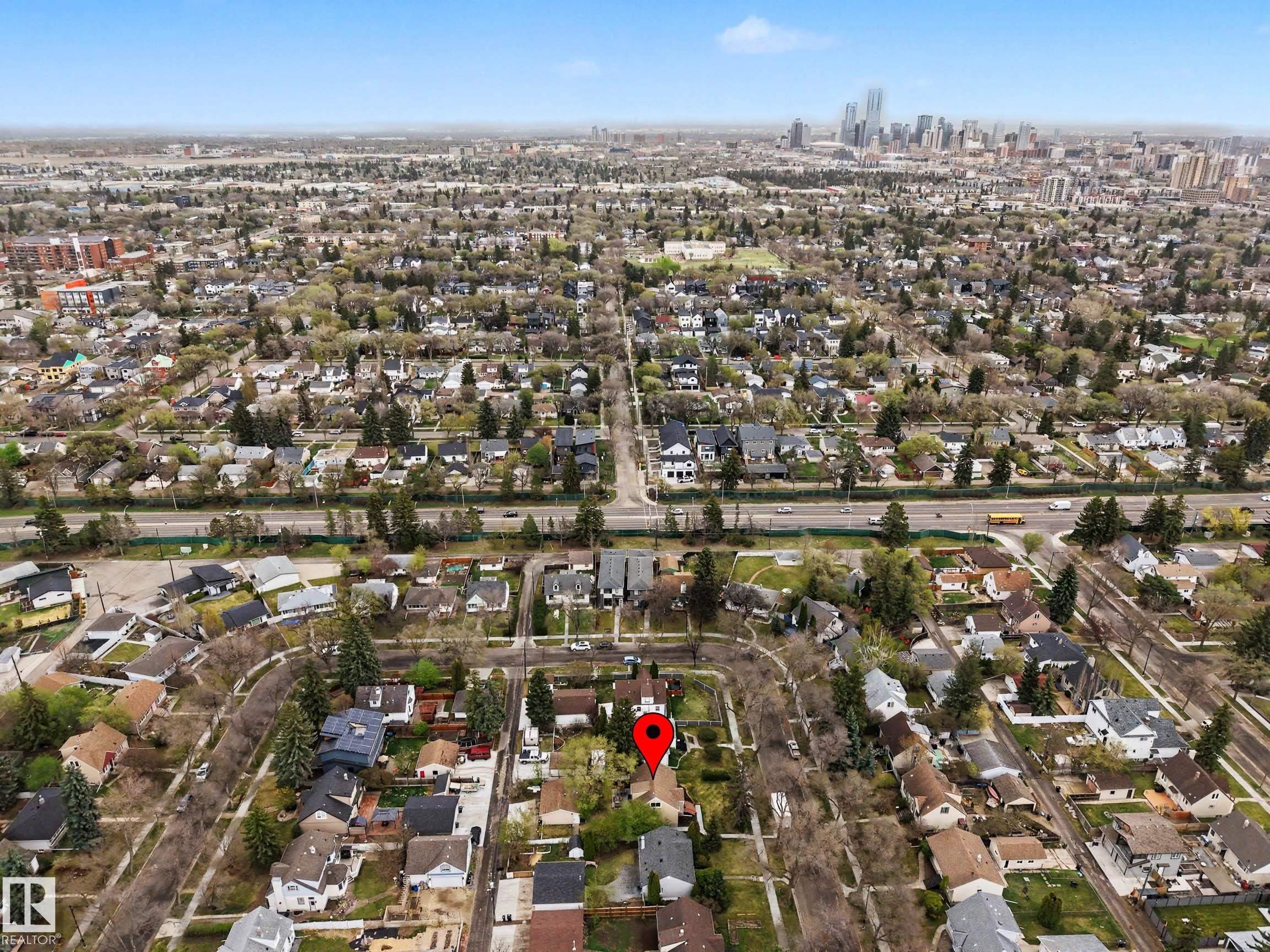 Aerial perspective showcasing a residential neighborhood with a distant urban skyline - 13316 109A Avenue, Edmonton, AB - Outdoor With View