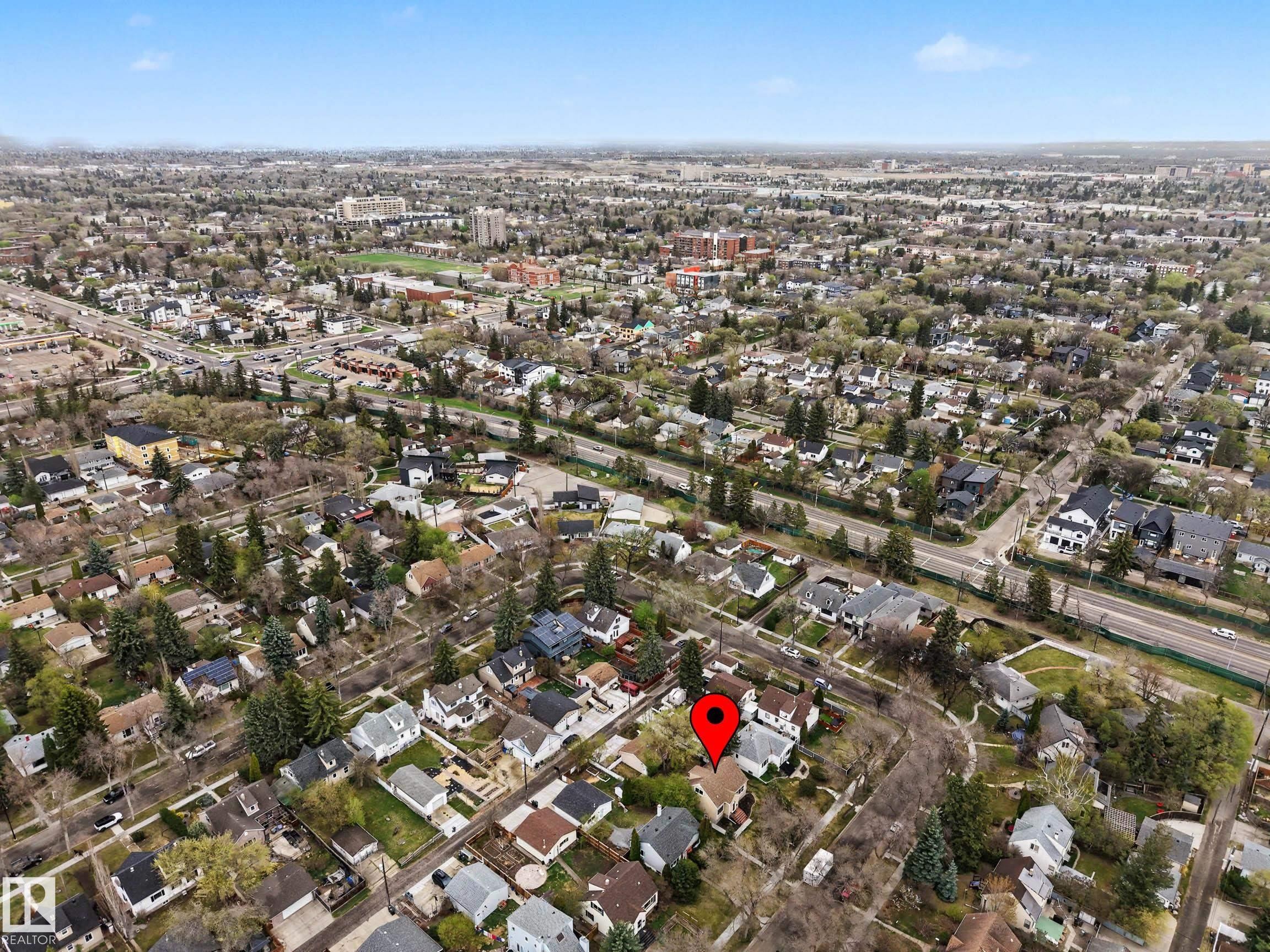 Aerial perspective showcasing a residential neighborhood with established trees and diverse architectural styles - 13316 109A Avenue, Edmonton, AB - Outdoor With View