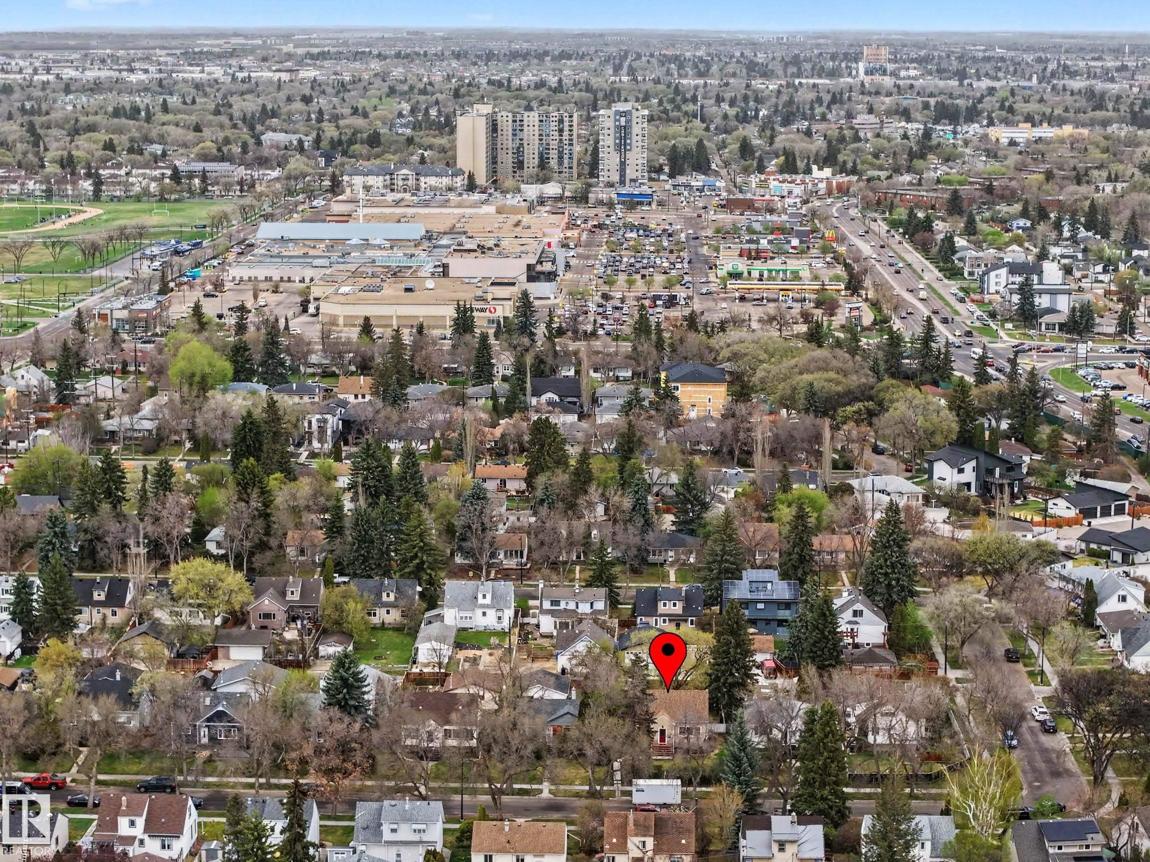 Aerial perspective showcasing a residential area with mature tree coverage - 13316 109A Avenue, Edmonton, AB - Outdoor With View