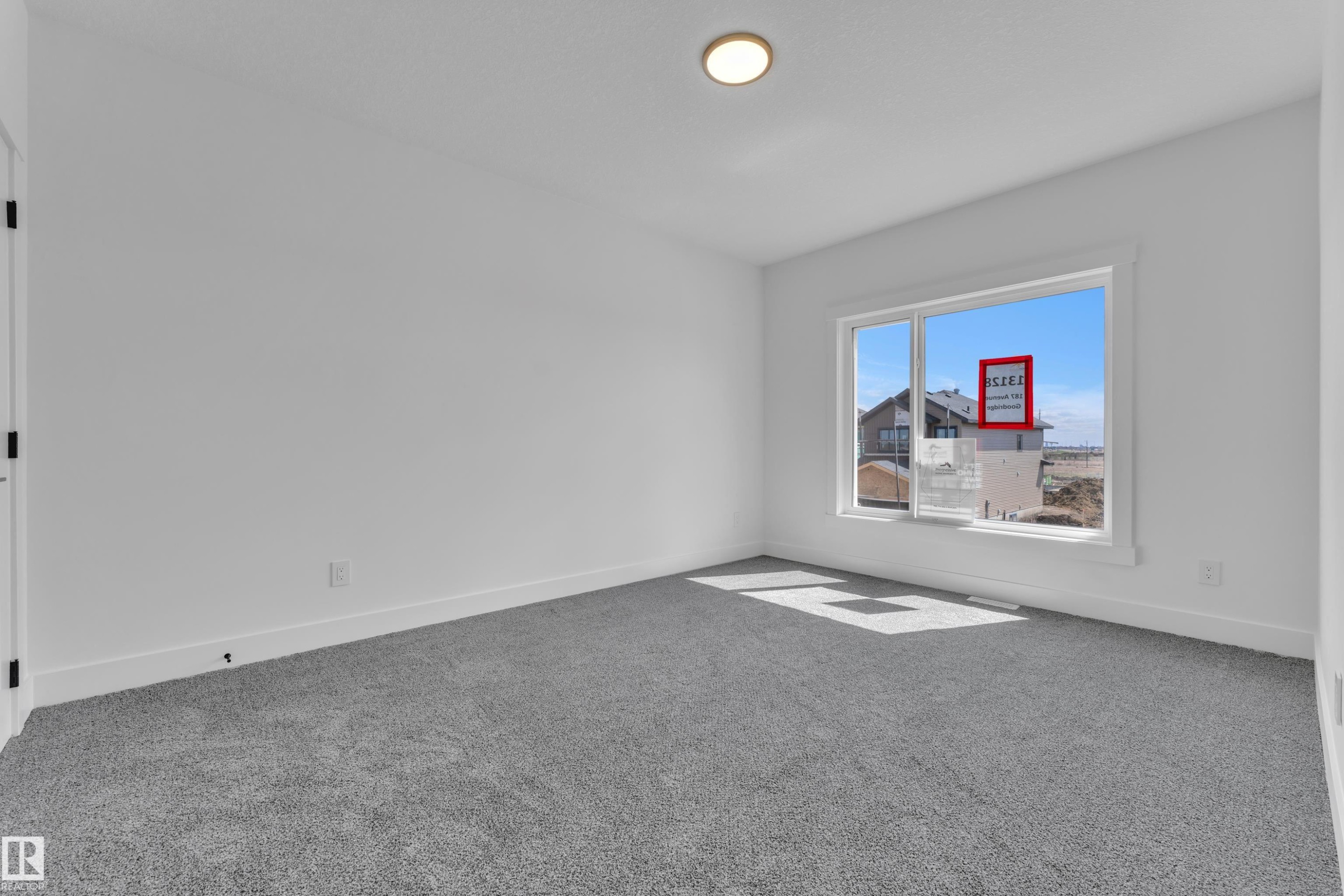 Interior room featuring neutral gray carpeting and white painted walls - 13128 187 Avenue, Edmonton, AB - Indoor Photo Showing Other Room