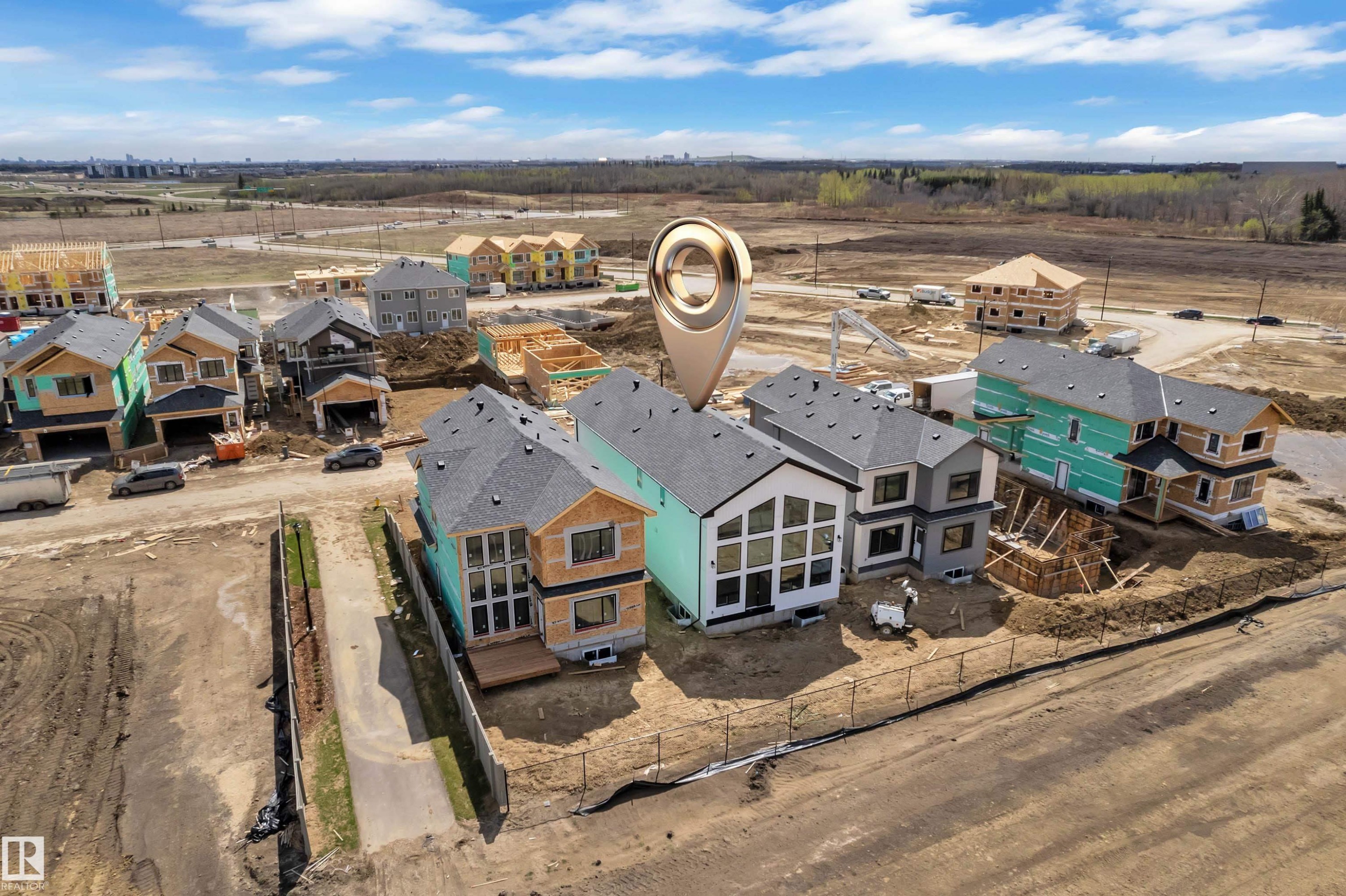 New construction residential development featuring multiple two-story homes in various stages of completion - 13128 187 Avenue, Edmonton, AB - Outdoor With View