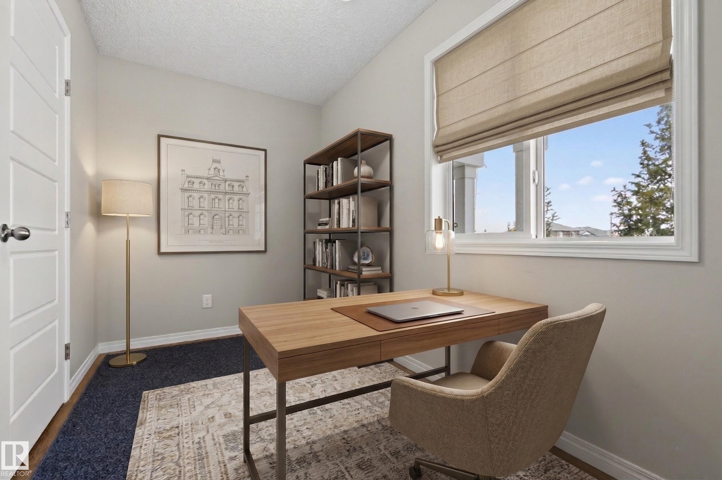 This room features a window with a roller shade, light-colored walls, and a desk - 15 2072 Wonnacott Way, Edmonton, AB - Indoor Photo Showing Office