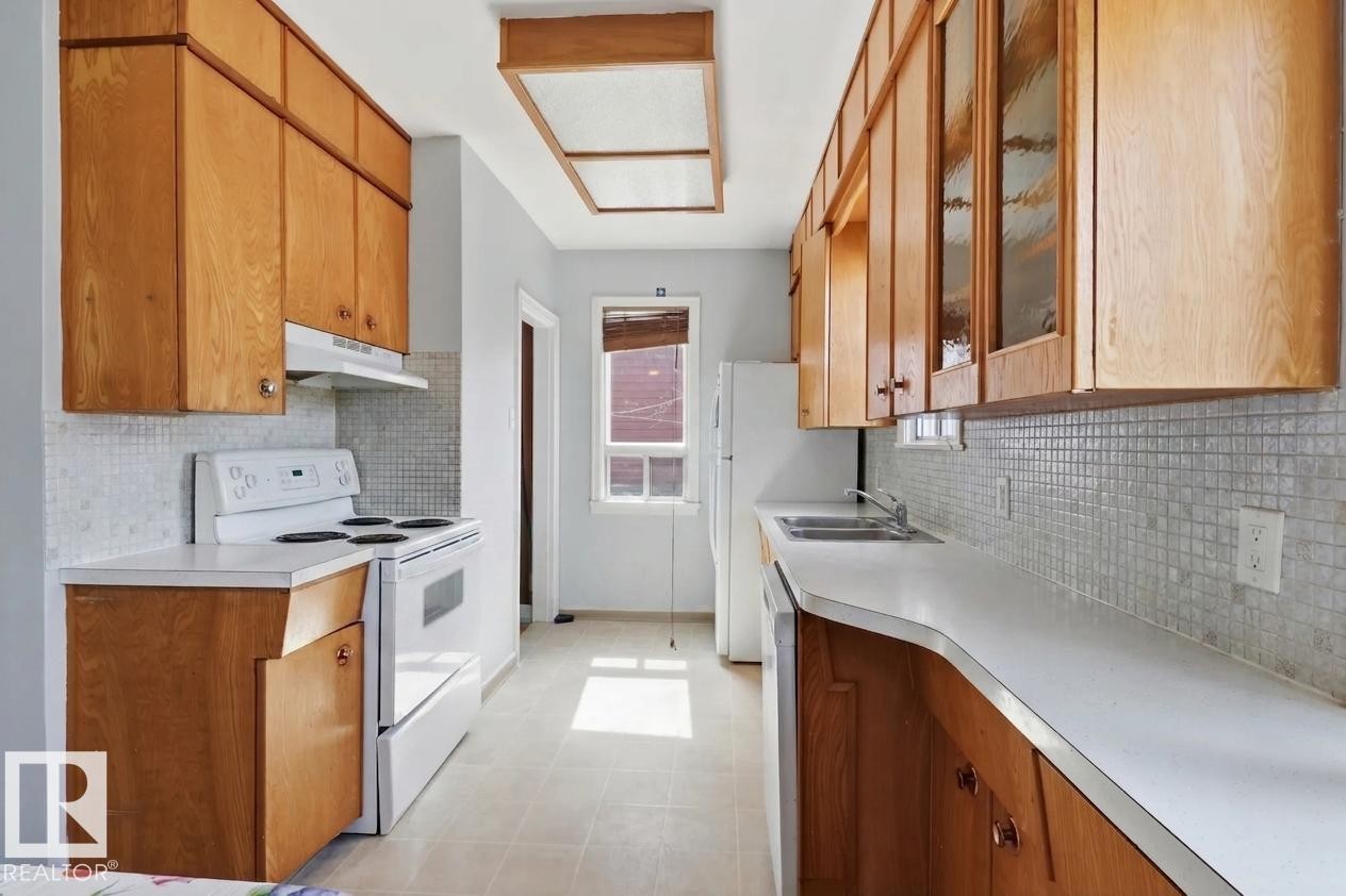 9206 90 Street, Edmonton, AB - Indoor Photo Showing Kitchen With Double Sink