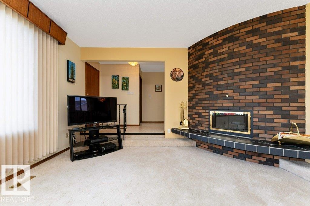6719 31A Avenue, Edmonton, AB - Indoor Photo Showing Living Room With Fireplace