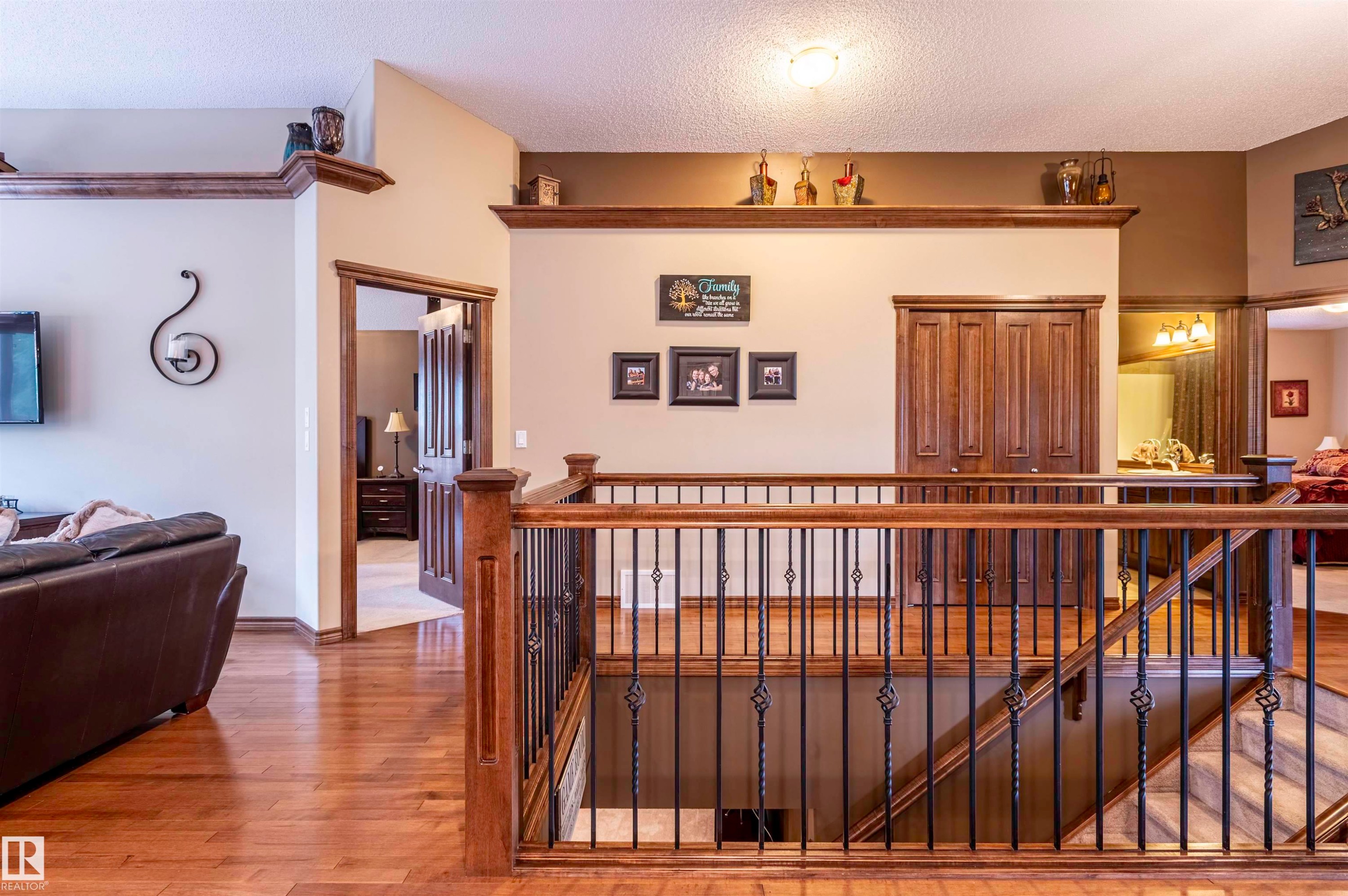 Hardwood flooring throughout the upper level and staircase - 19 Newton Place, St. Albert, AB - Indoor Photo Showing Other Room