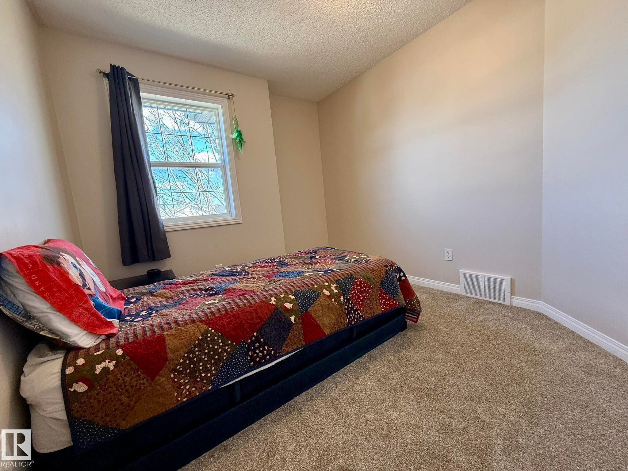 3rd Upper Floor Bedroom with the new carpet & paint! - 645 Windross Crescent, Edmonton, AB
