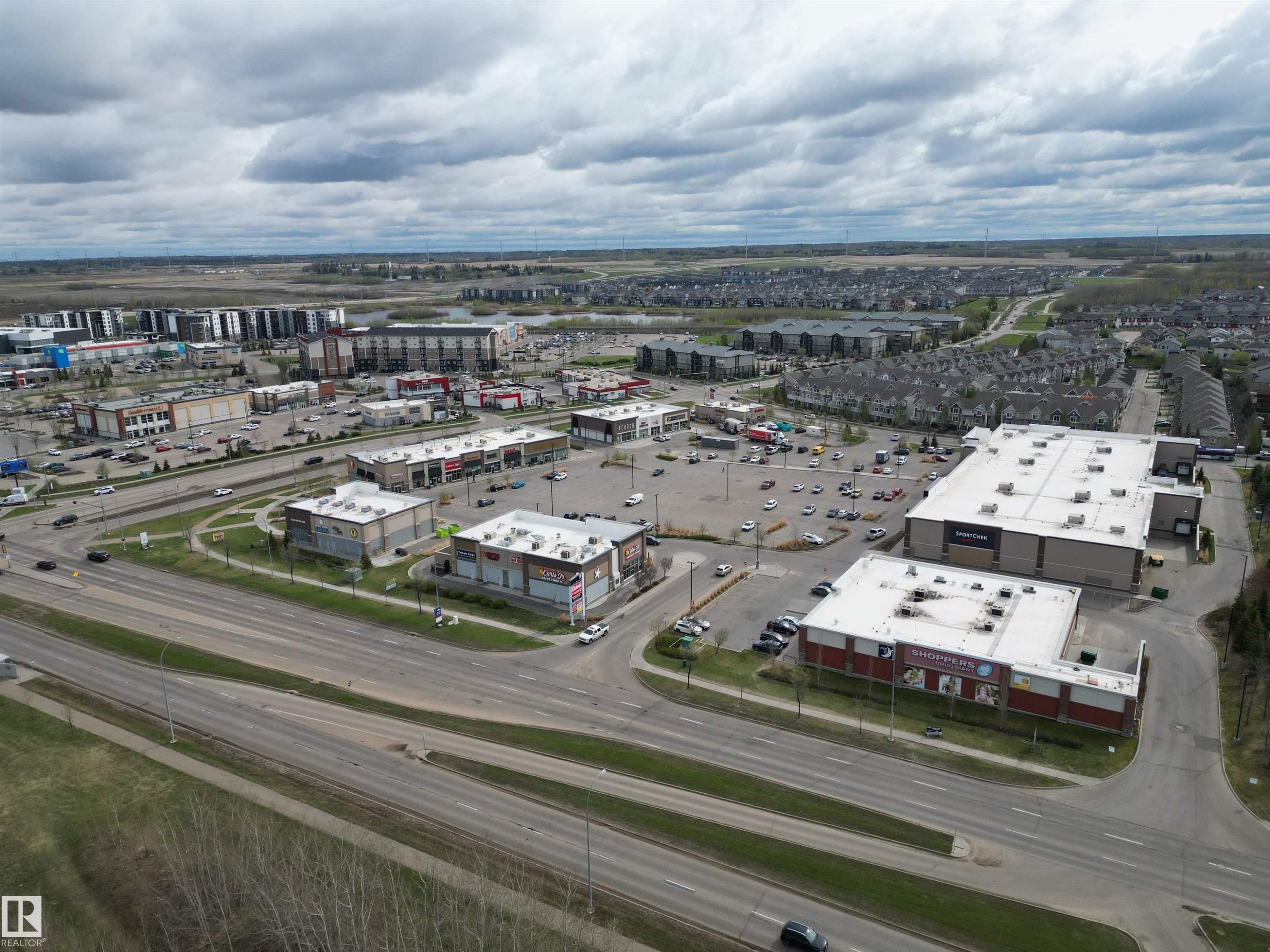 Commercial retail development featuring multiple tenant spaces and ample on-site parking - 645 Windross Crescent, Edmonton, AB