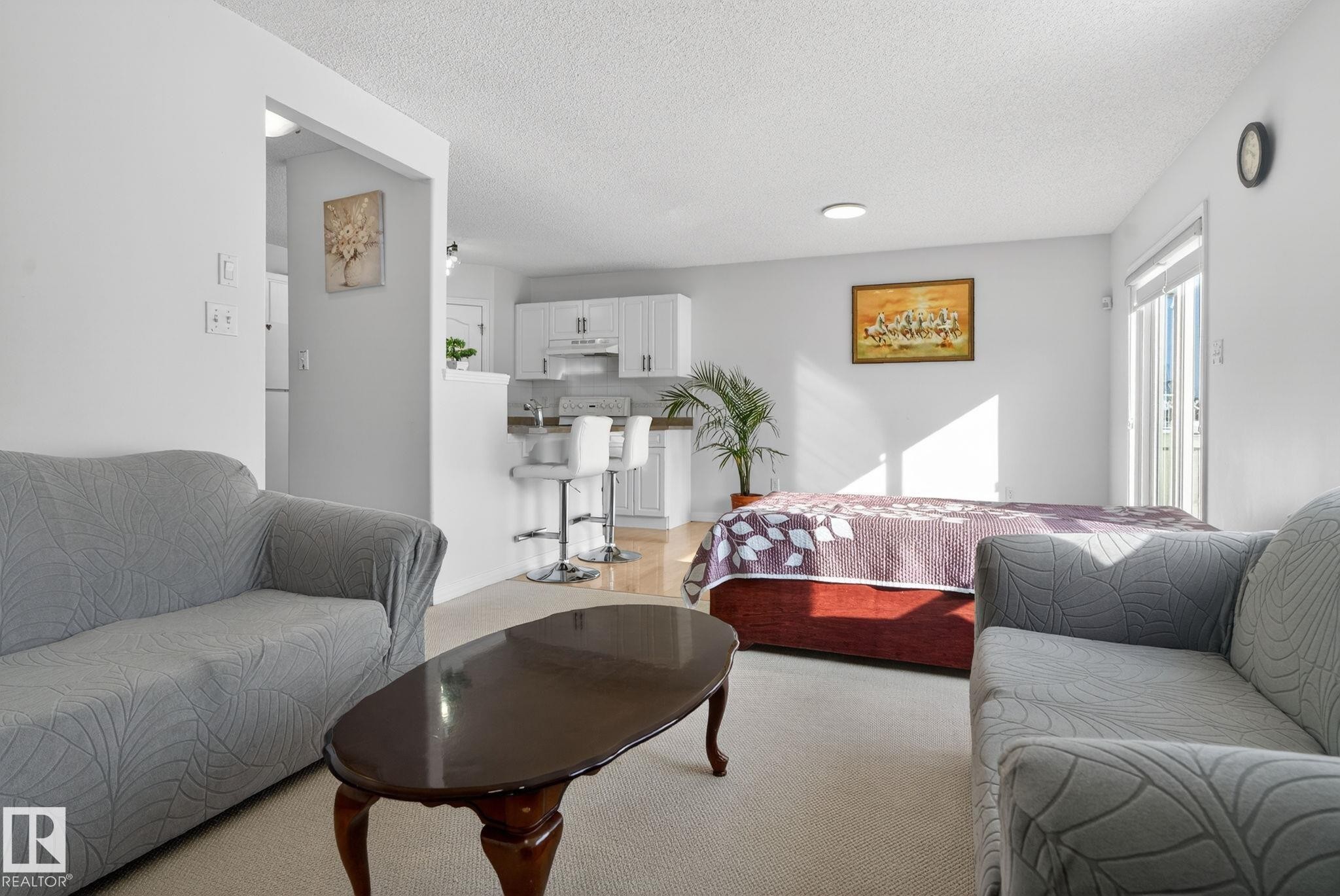 Carpeted living area with light-toned walls and recessed lighting - 421 84 Street, Edmonton, AB - Indoor Photo Showing Living Room