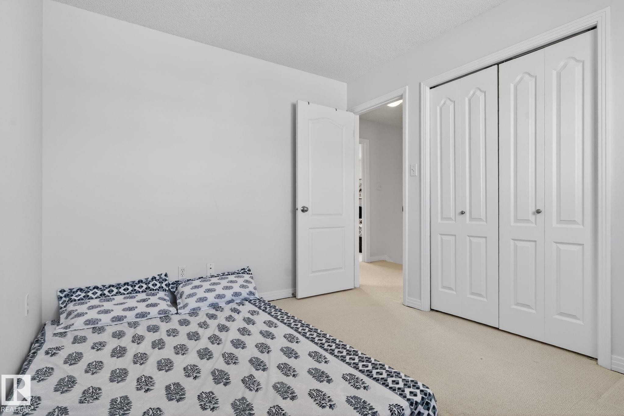 Neutral wall paint throughout - 421 84 Street, Edmonton, AB - Indoor Photo Showing Bedroom
