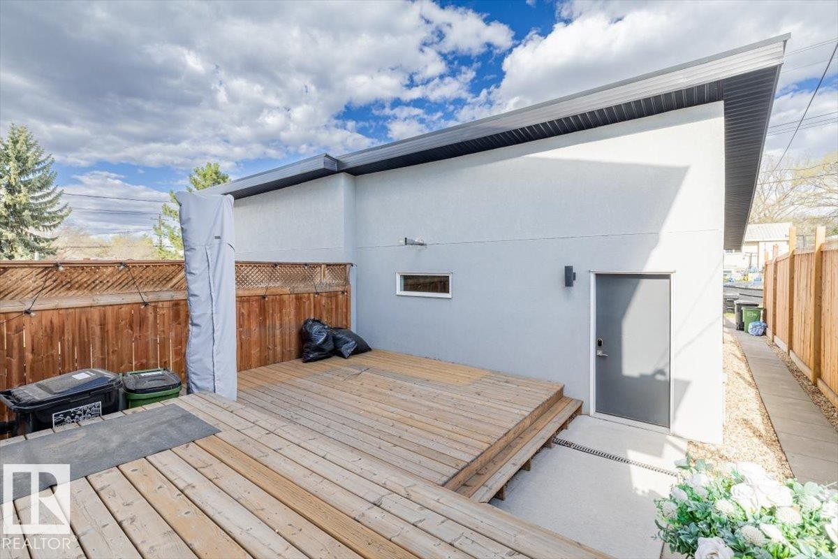 Outdoor deck area featuring natural wood planking - 9933 79 Street, Edmonton, AB - Outdoor With Deck Patio Veranda With Exterior