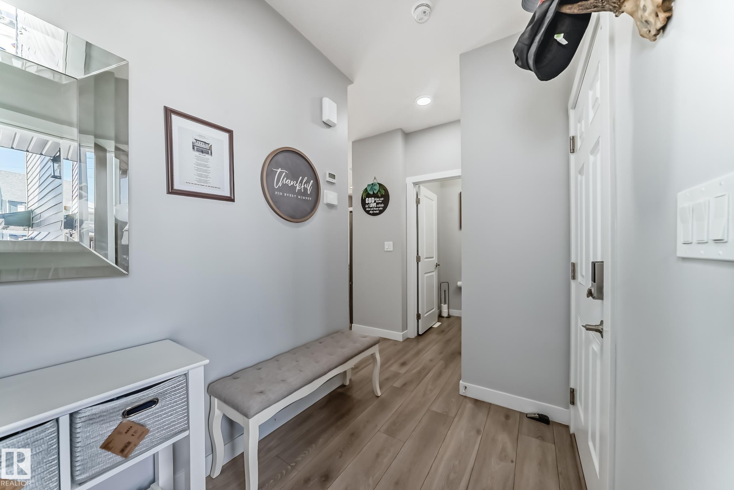 Foyer with contemporary light gray walls, recessed lighting, and wood-finish flooring - 19635 29 Avenue, Edmonton, AB - Indoor Photo Showing Other Room