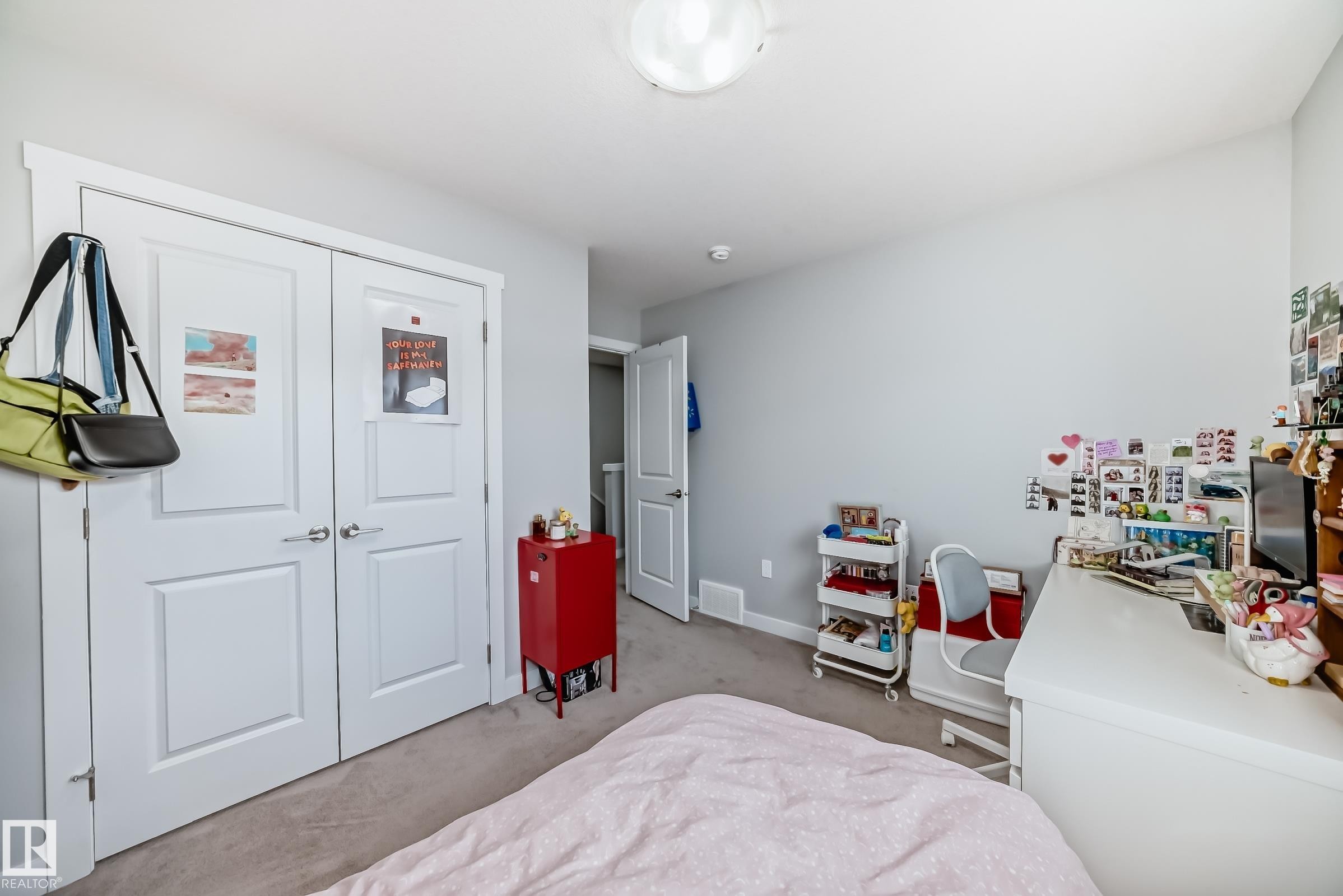 Interior room featuring light gray wall paint, white trim, and a flush mount ceiling light fixture - 19635 29 Avenue, Edmonton, AB - Indoor Photo Showing Bedroom