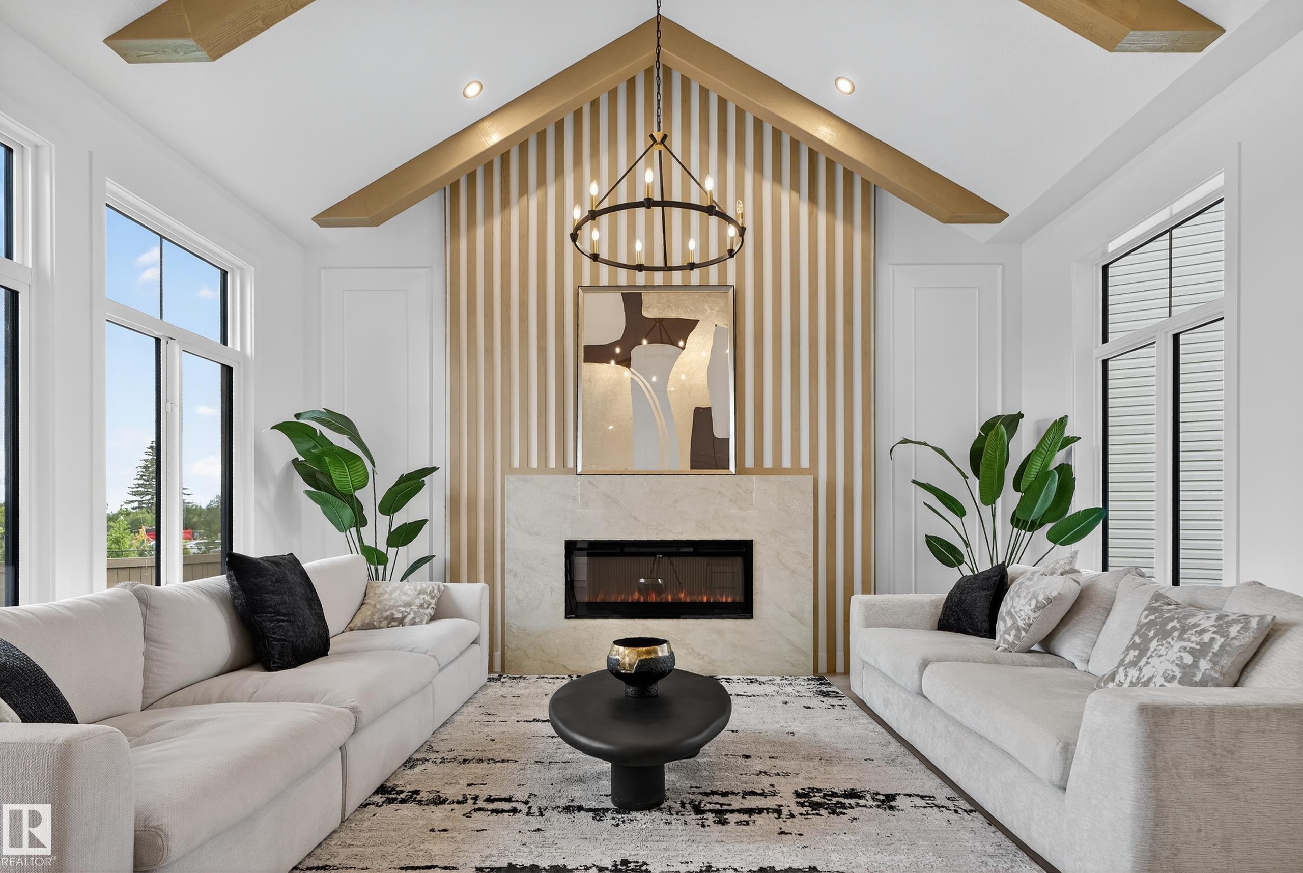 Vaulted ceiling with exposed wood-finish beams - 711 166 Avenue, Edmonton, AB - Indoor Photo Showing Living Room With Fireplace