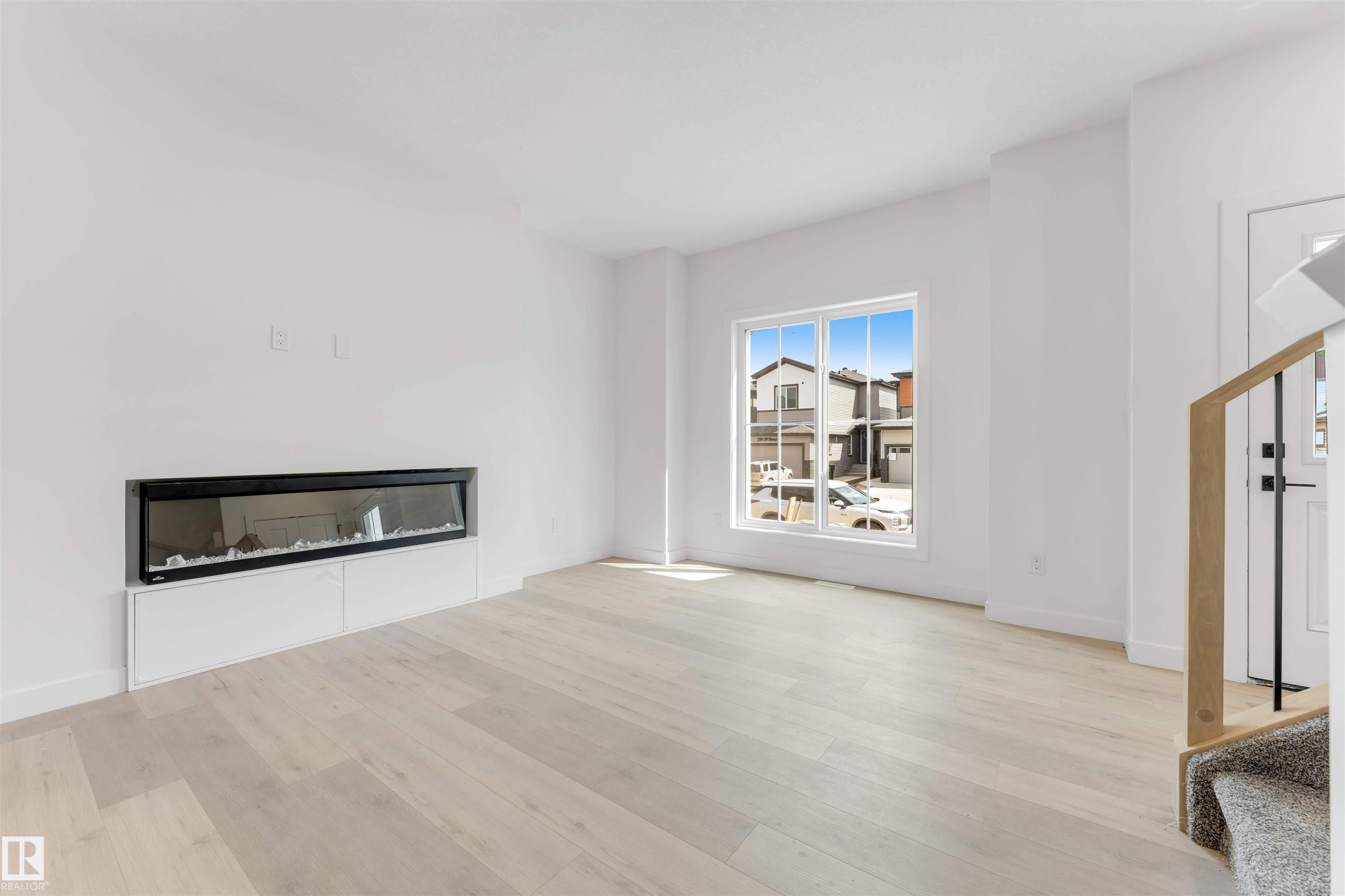 232 24 Street, Edmonton, AB - Indoor Photo Showing Living Room With Fireplace
