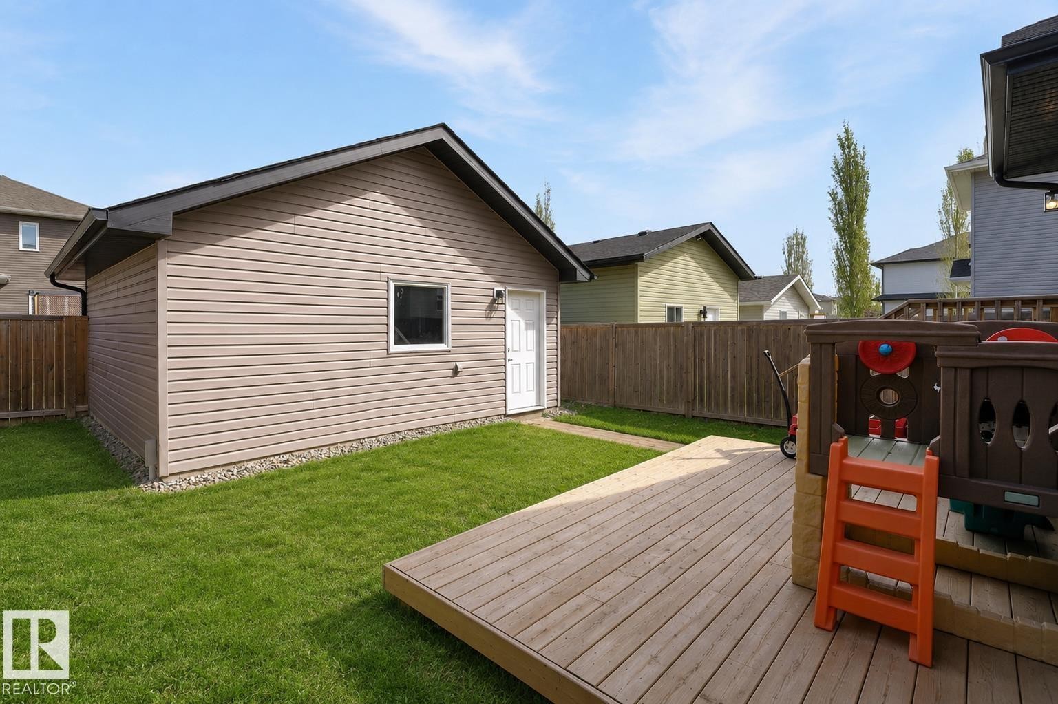 Detached garage with horizontal siding and a side entry door - 108 Hewitt Circle, Spruce Grove, AB - Outdoor With Exterior