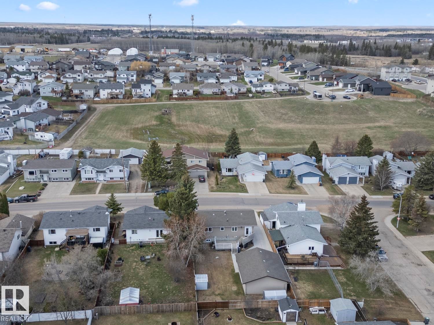 Aerial perspective showcasing a residential neighborhood with varied home styles and surrounding natural landscapes - 1304 12 Street, Cold Lake, AB - Outdoor With View
