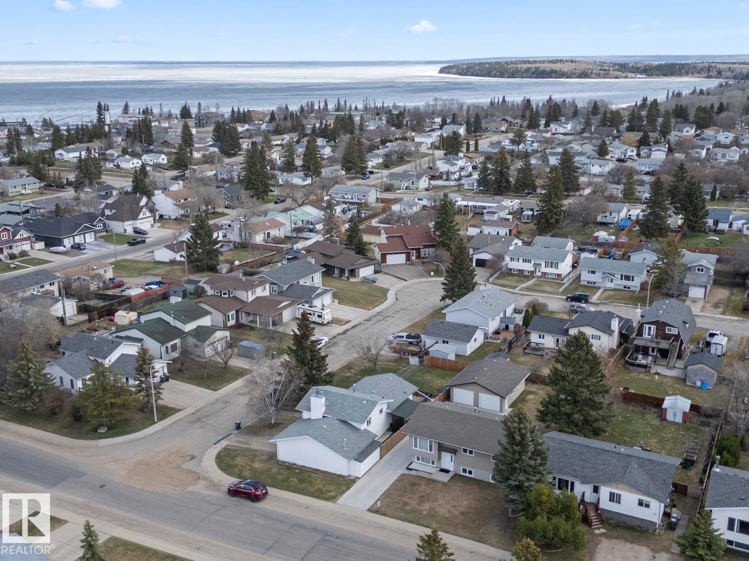 Aerial perspective showcasing a residential neighborhood with varied home styles - 1304 12 Street, Cold Lake, AB - Outdoor With Body Of Water With View