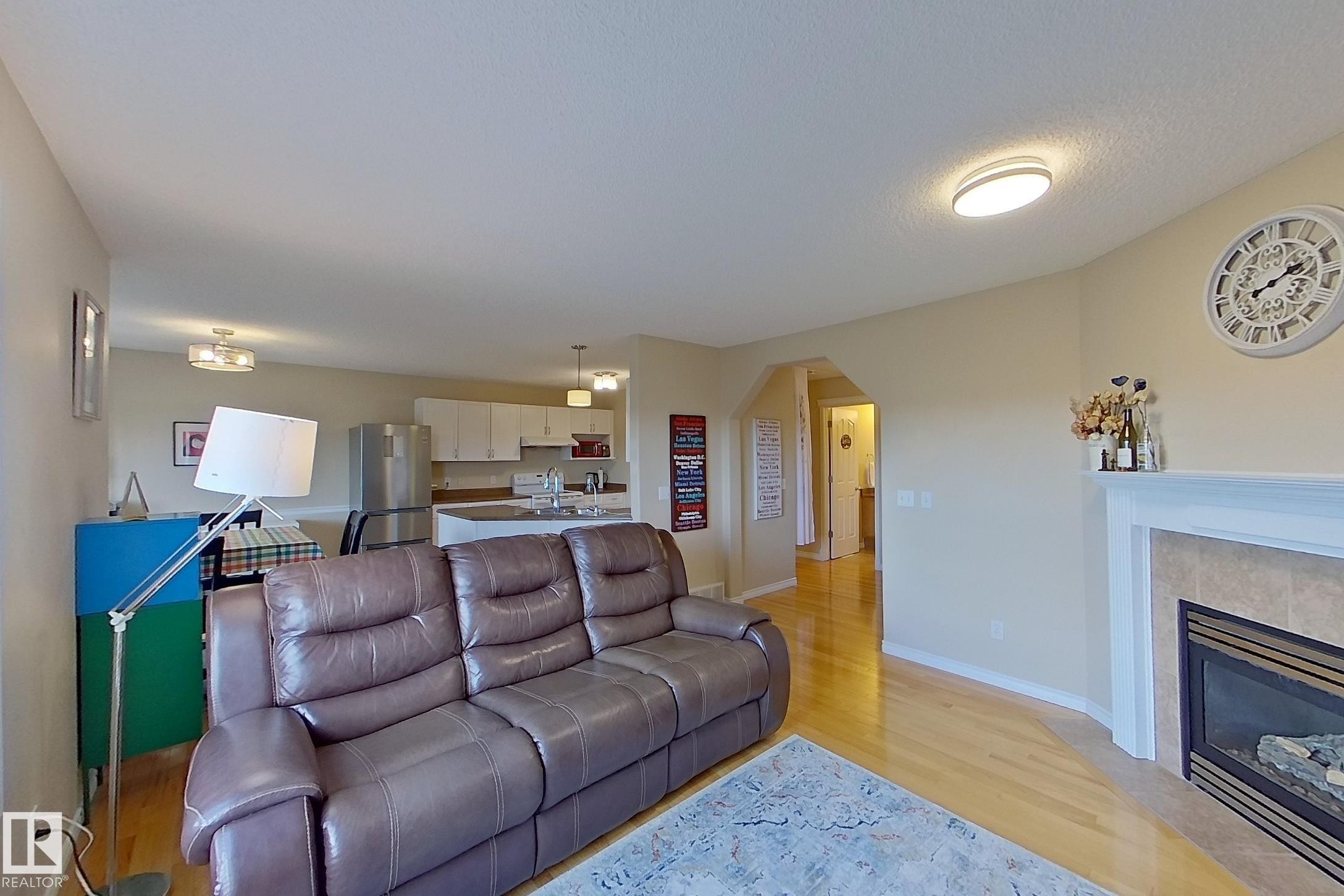 3540 Mclean Crescent, Edmonton, AB - Indoor Photo Showing Living Room With Fireplace