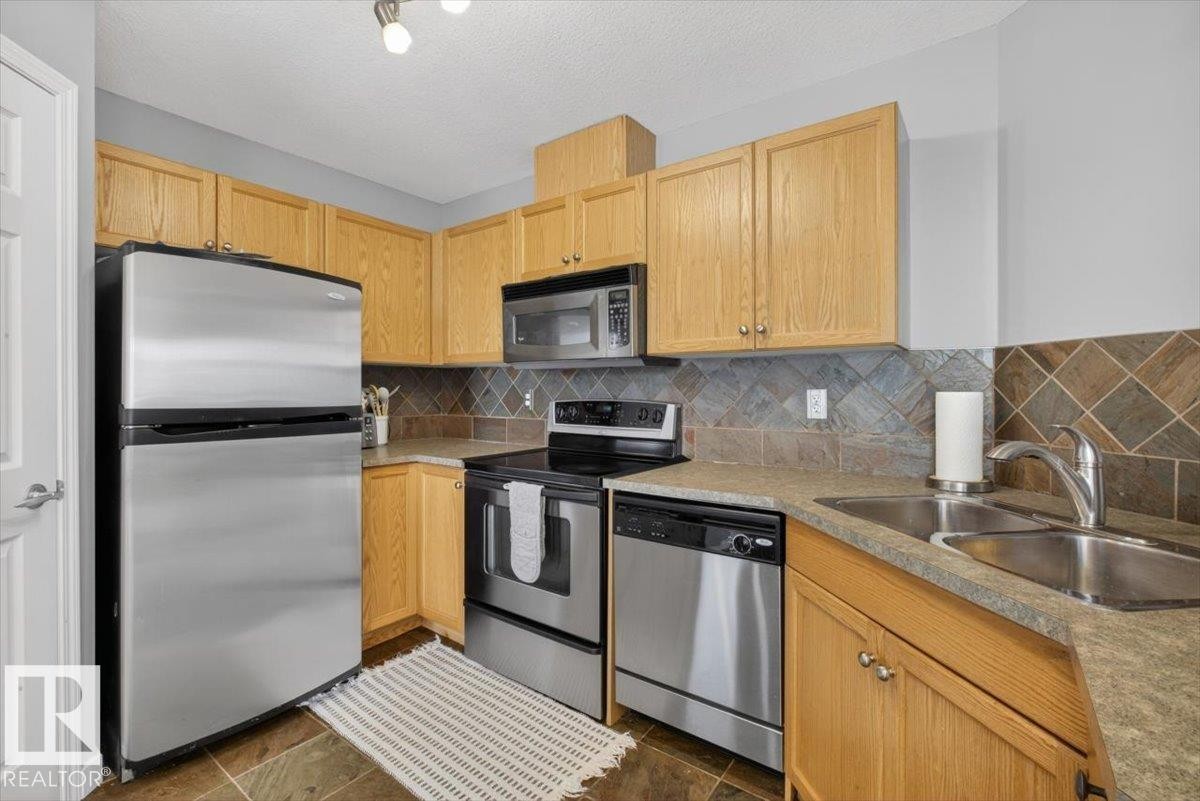 50 150 Edwards Drive, Edmonton, AB - Indoor Photo Showing Kitchen With Stainless Steel Kitchen With Double Sink