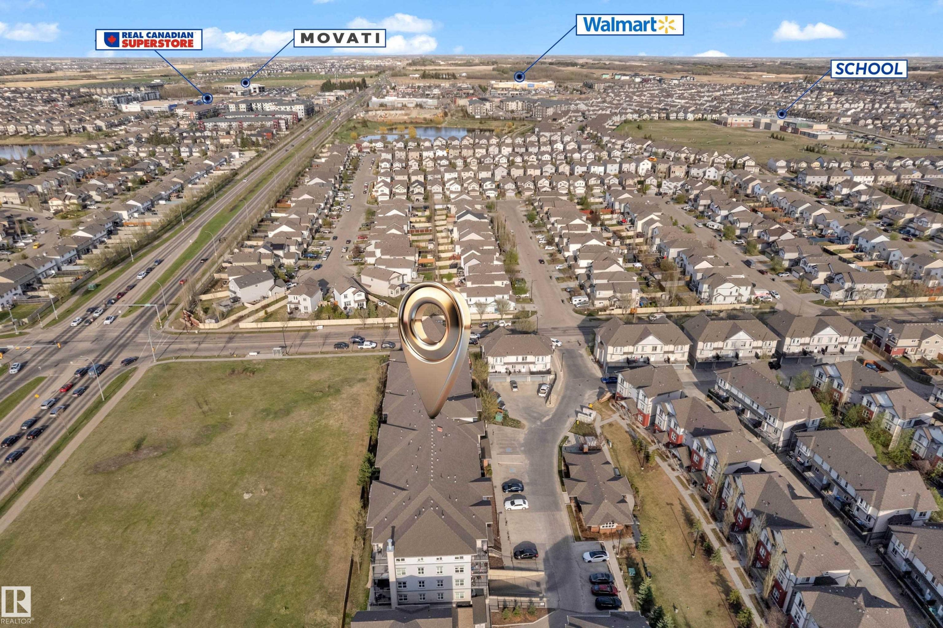 Aerial view showcasing a residential neighborhood with numerous homes featuring dark roofs - 217 667 Watt Boulevard, Edmonton, AB - Outdoor With View