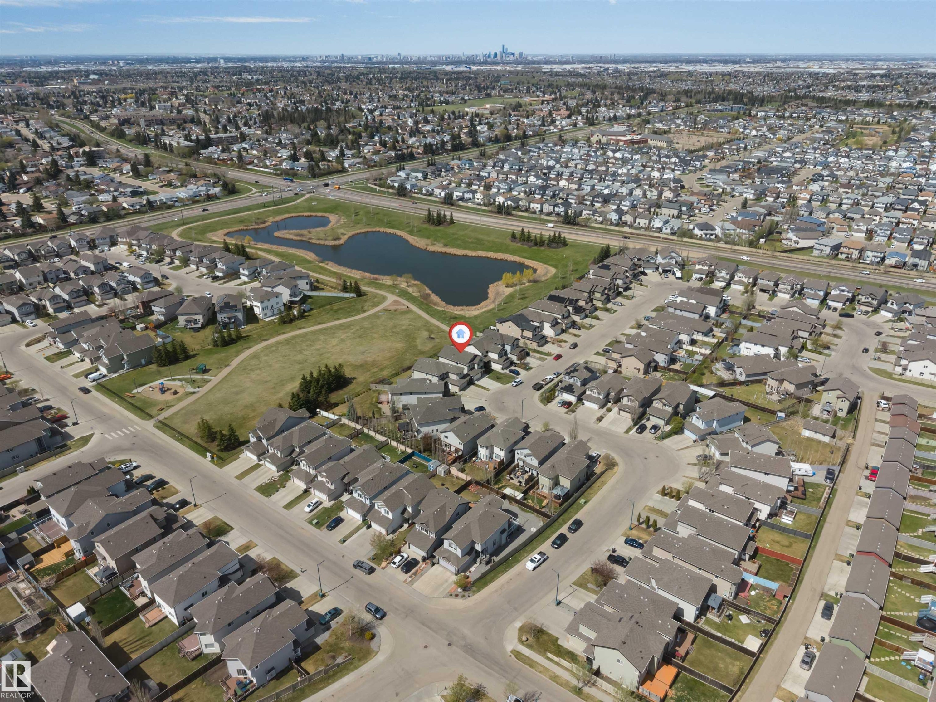 Aerial overview showcasing a residential neighborhood with varied housing styles - 2138 32B Street, Edmonton, AB -