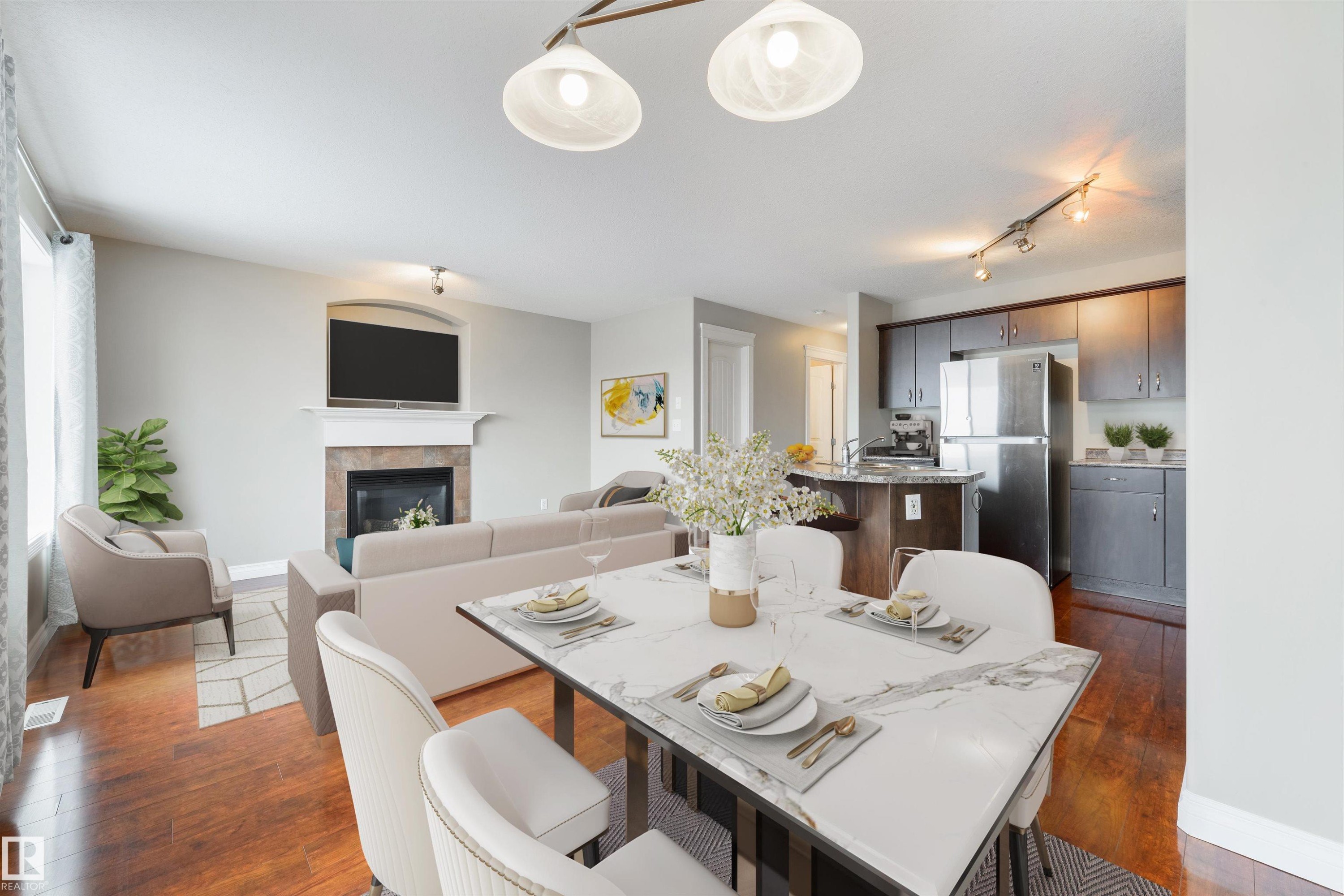 68 Meridian Loop, Stony Plain, AB - Indoor Photo Showing Dining Room With Fireplace