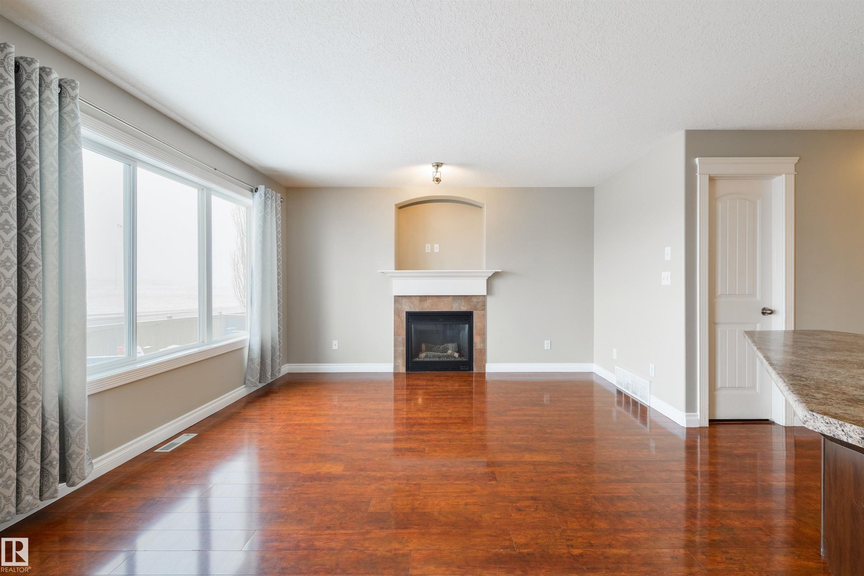 68 Meridian Loop, Stony Plain, AB - Indoor Photo Showing Living Room With Fireplace