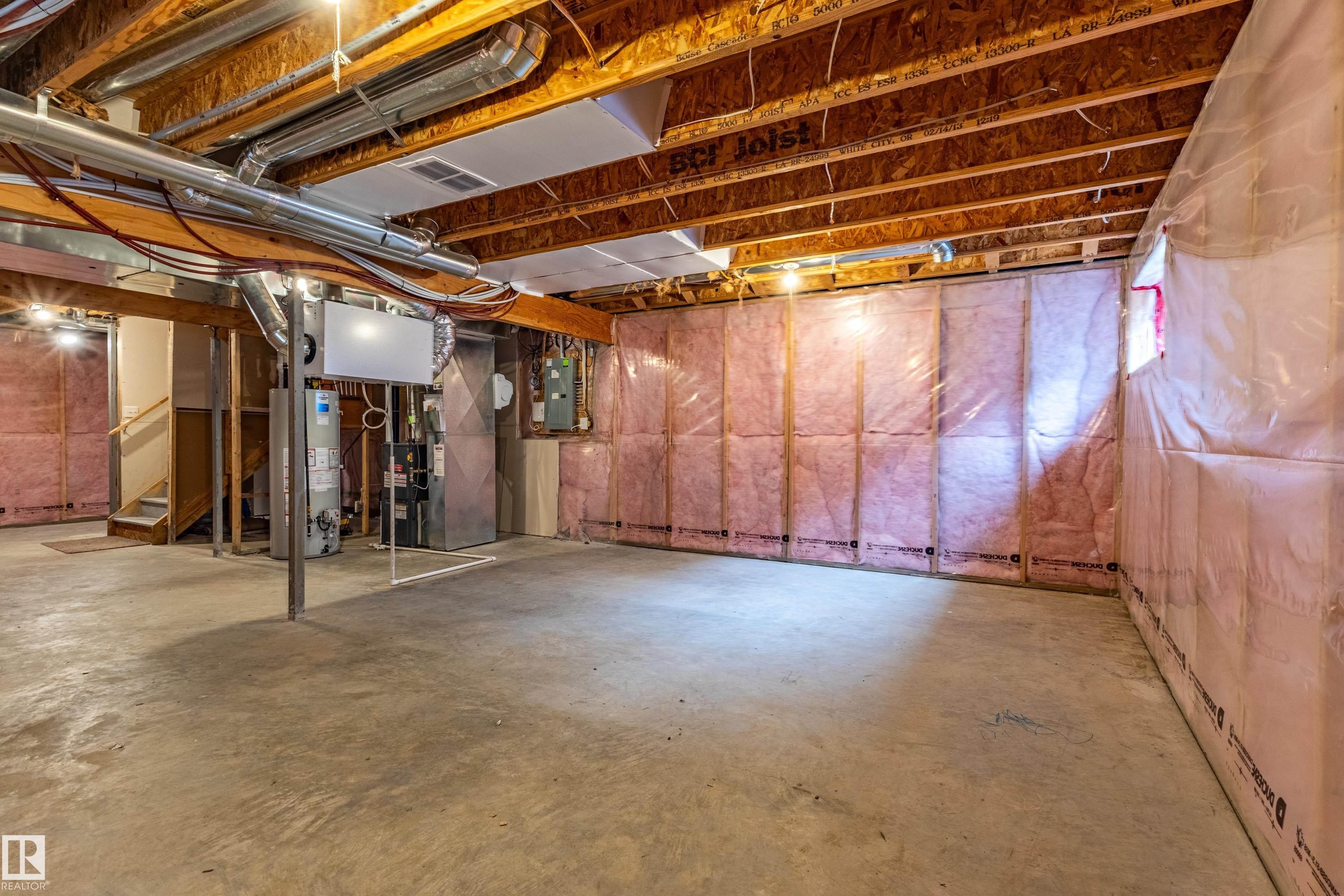 Unfinished basement offering expansive concrete flooring - 17715 6 Avenue, Edmonton, AB - Indoor Photo Showing Basement